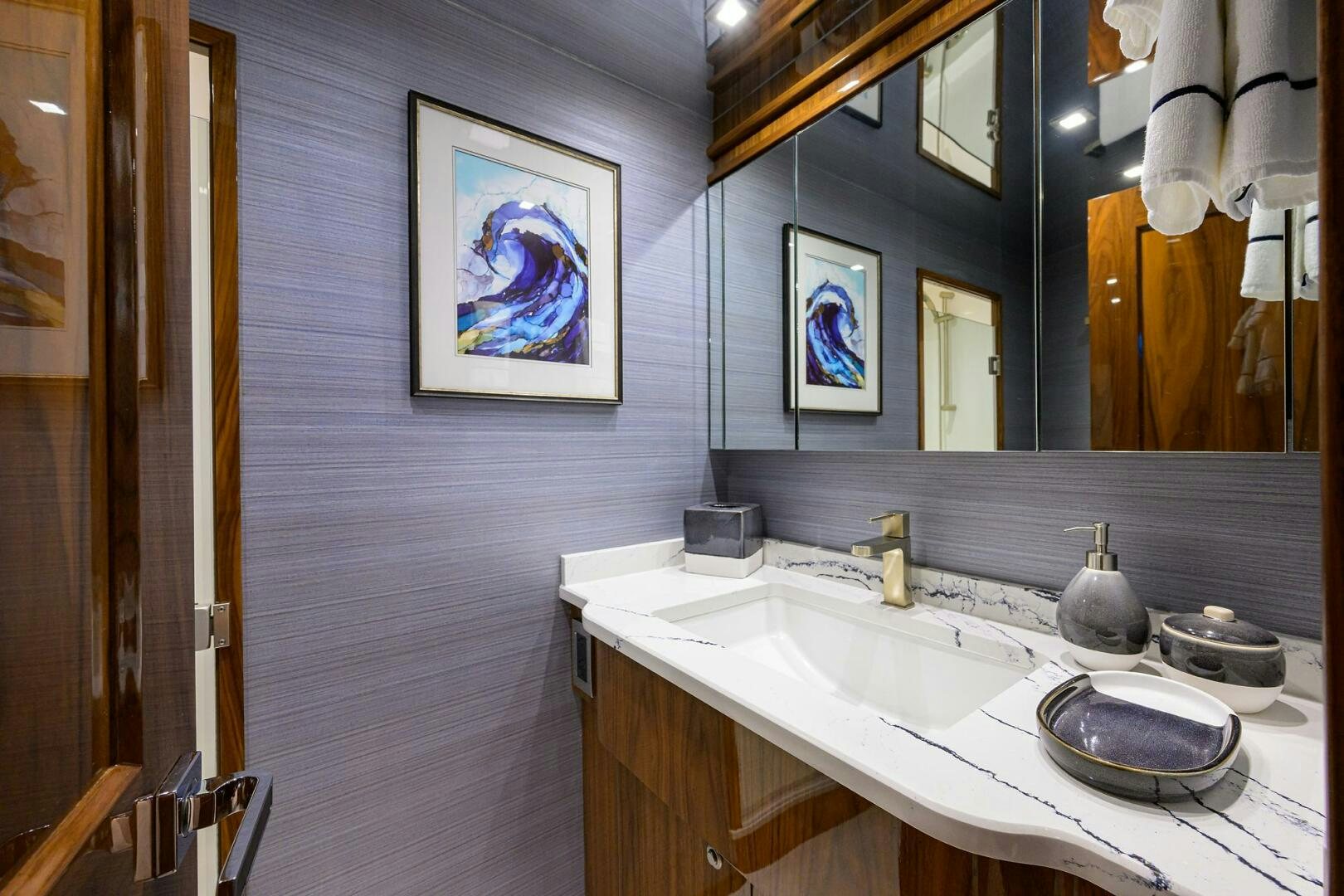 a bathroom with a sink and a mirror aboard FOR PETE'S SAKE Yacht for Sale