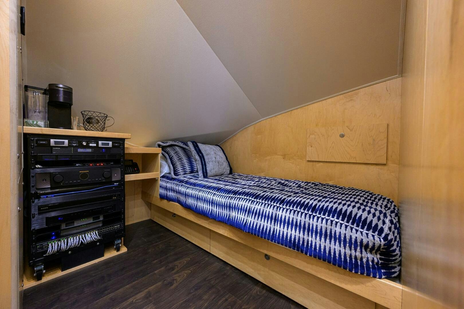 a bed with a blue and white striped bed spread aboard FOR PETE'S SAKE Yacht for Sale