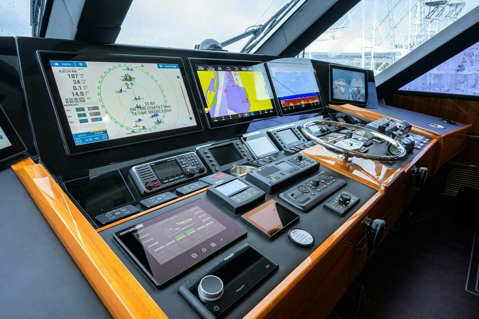 a table with many computer screens aboard FOR PETE'S SAKE Yacht for Sale