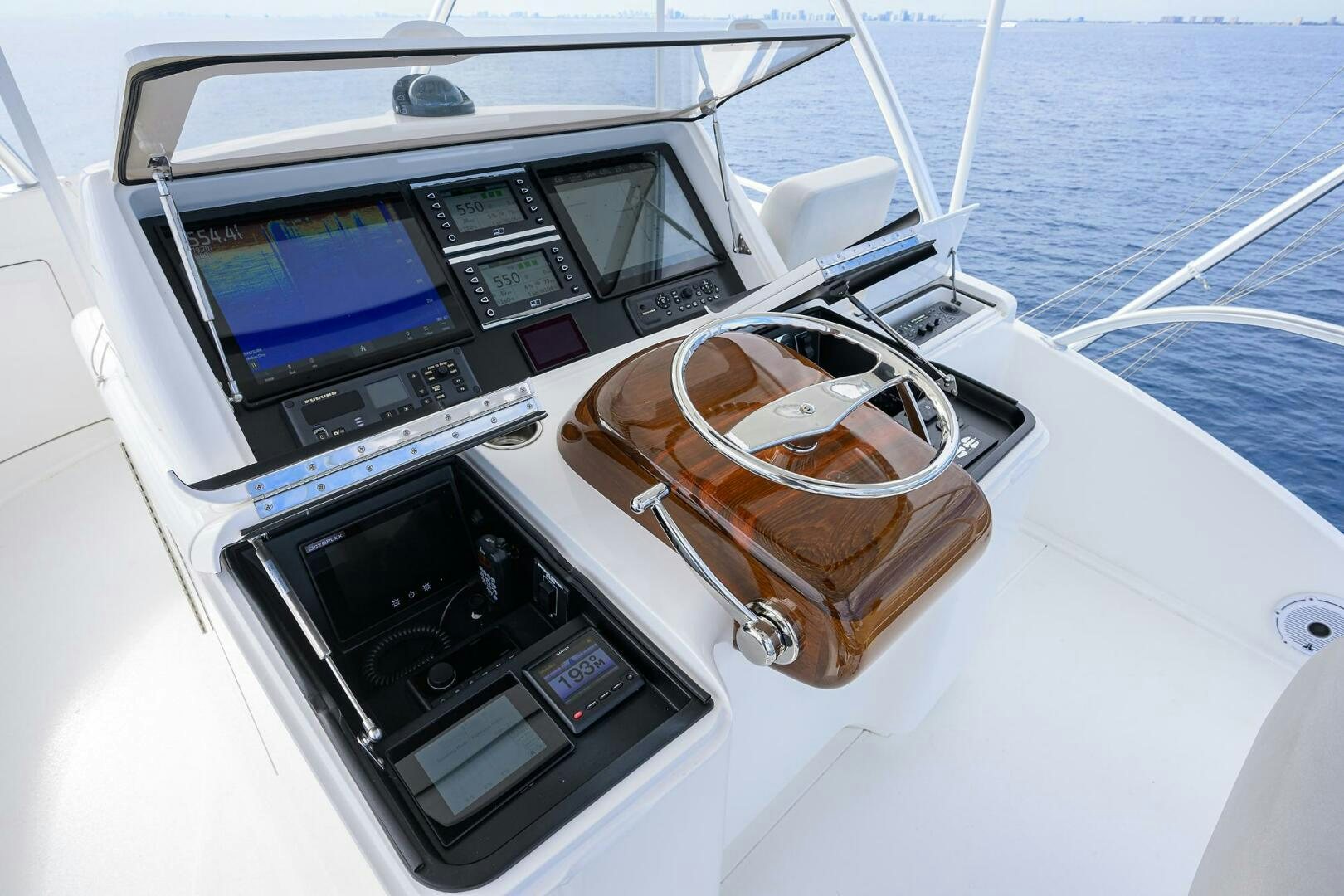 a boat with a couple of glasses on the front aboard FOR PETE'S SAKE Yacht for Sale