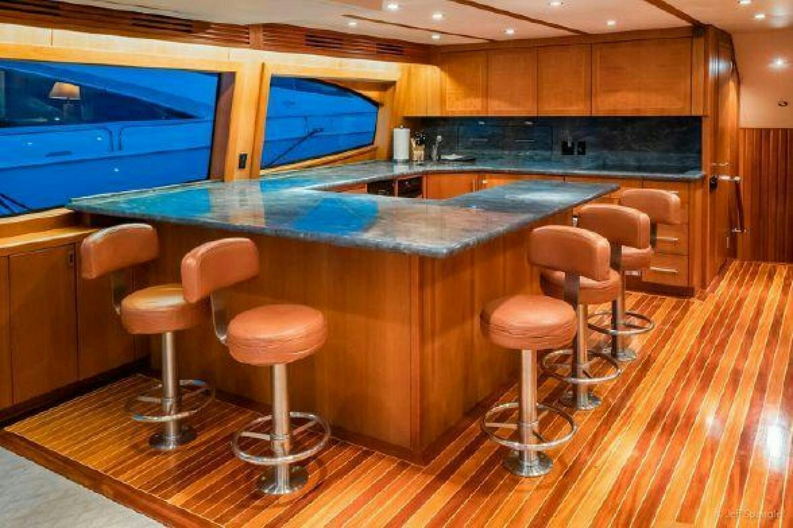 a bar with stools and stools aboard DESPERADO Yacht for Sale