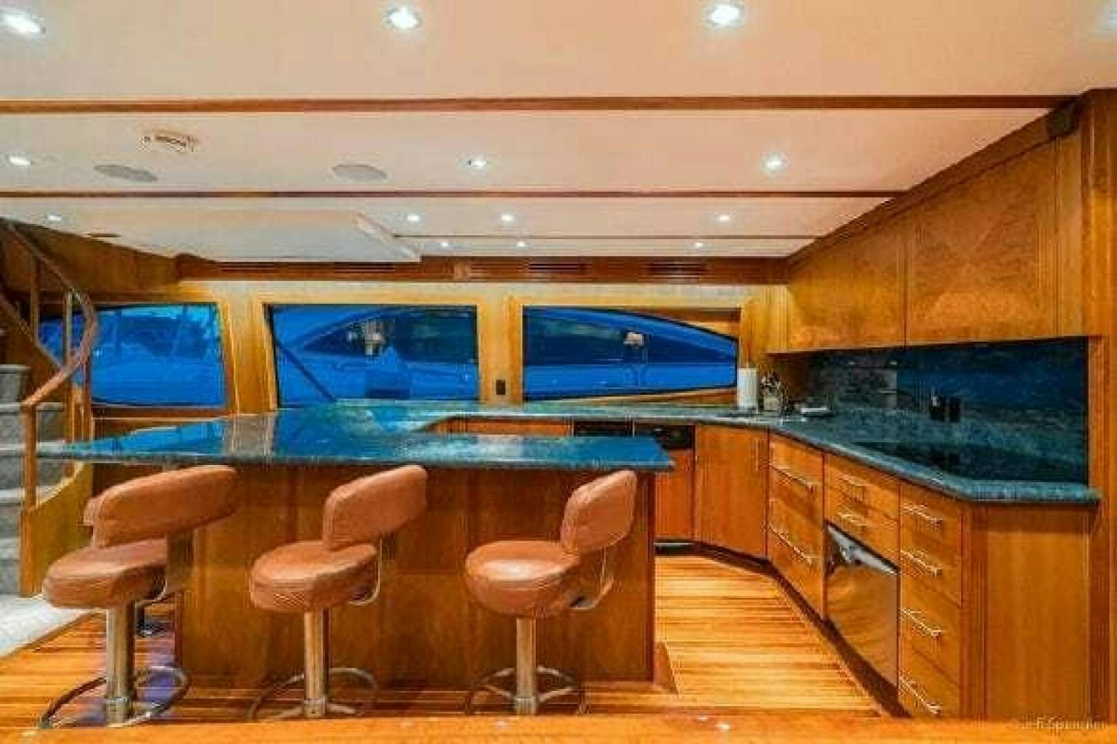 a room with a pool table and chairs aboard DESPERADO Yacht for Sale