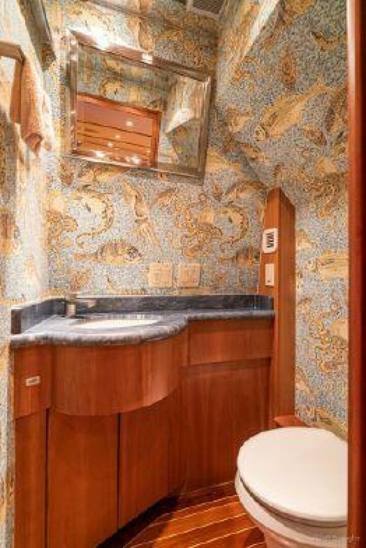 a bathroom with a sink and a toilet aboard DESPERADO Yacht for Sale