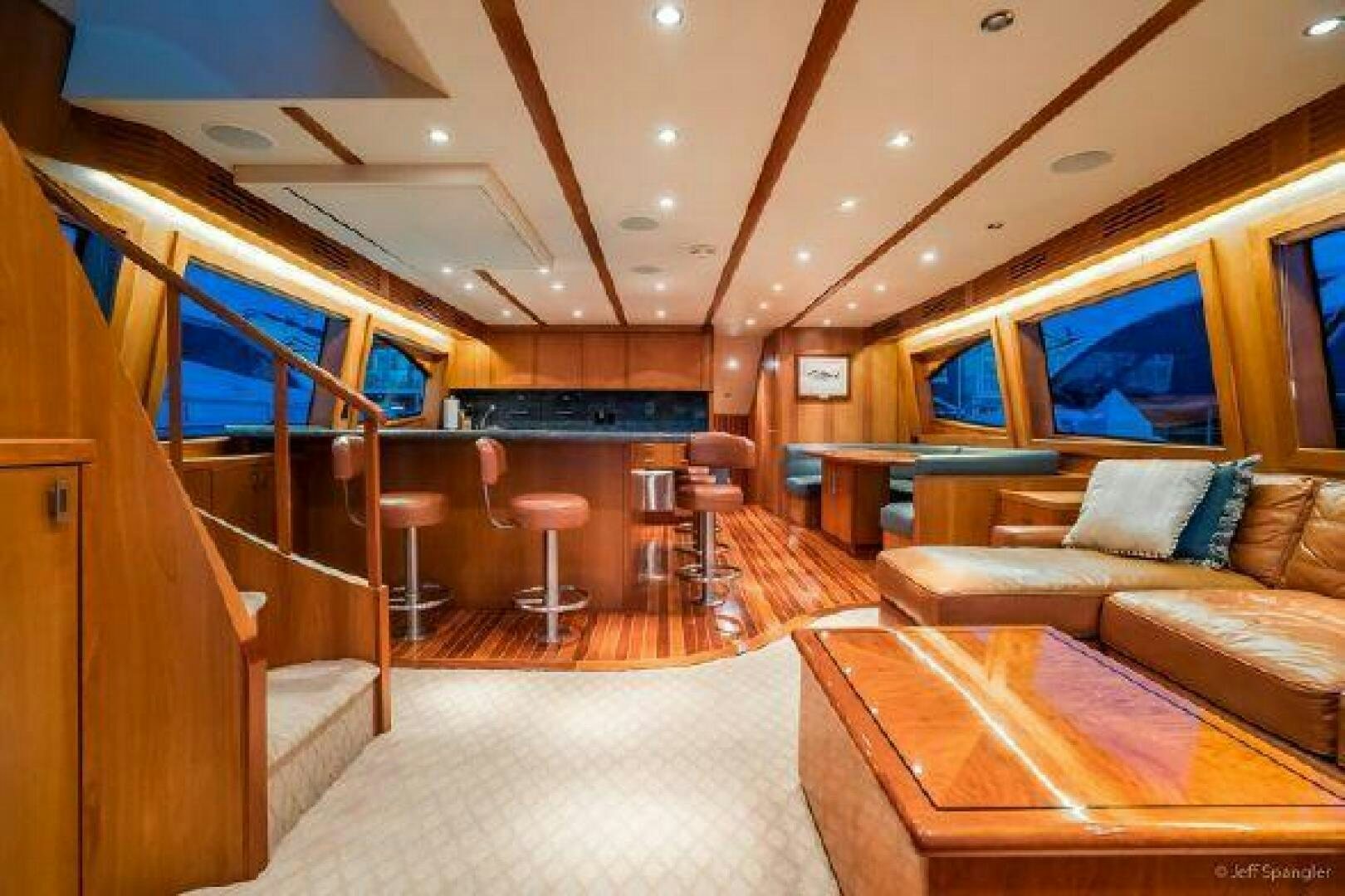 a room with a couch and a table aboard DESPERADO Yacht for Sale