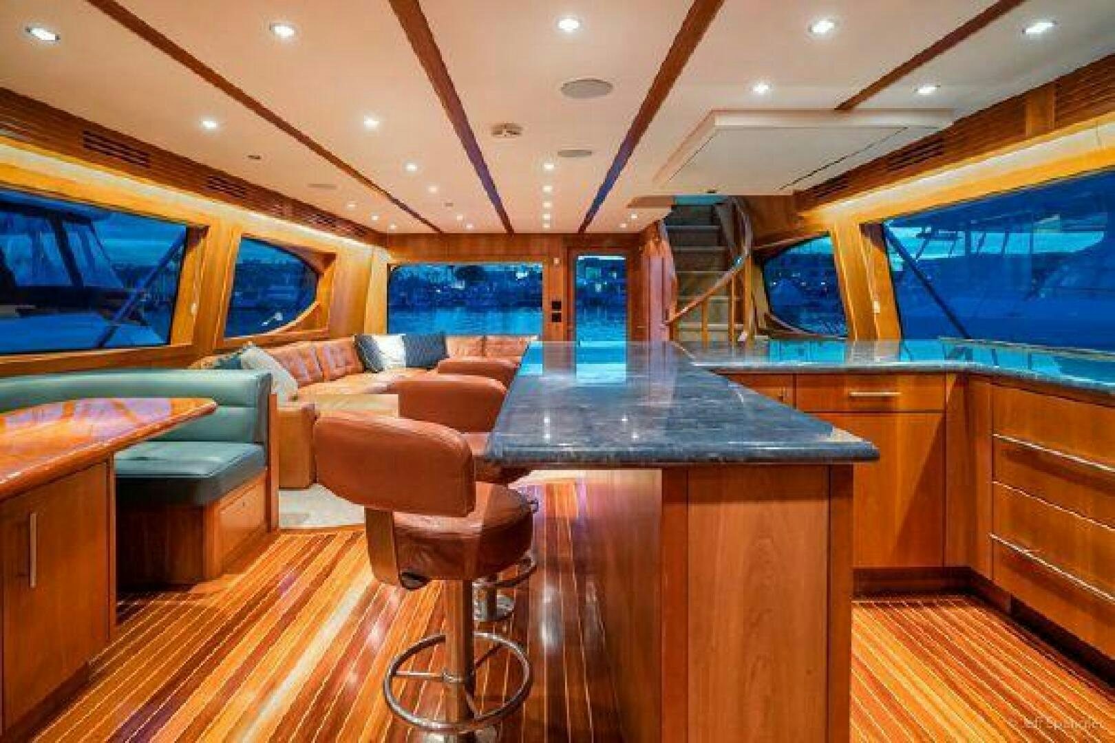a bar with a bar and chairs aboard DESPERADO Yacht for Sale