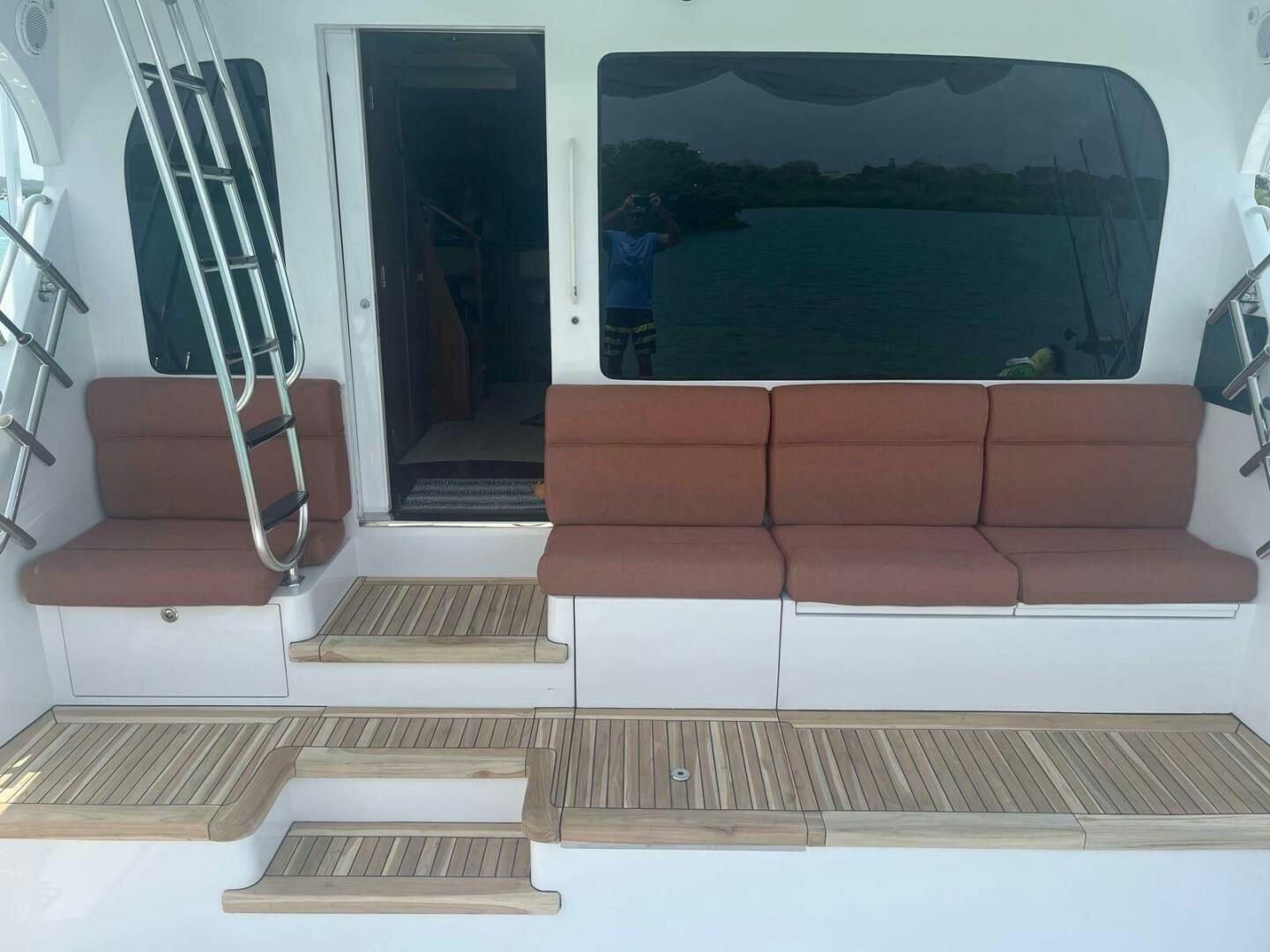 a living room with a couch and a ladder aboard DESPERADO Yacht for Sale