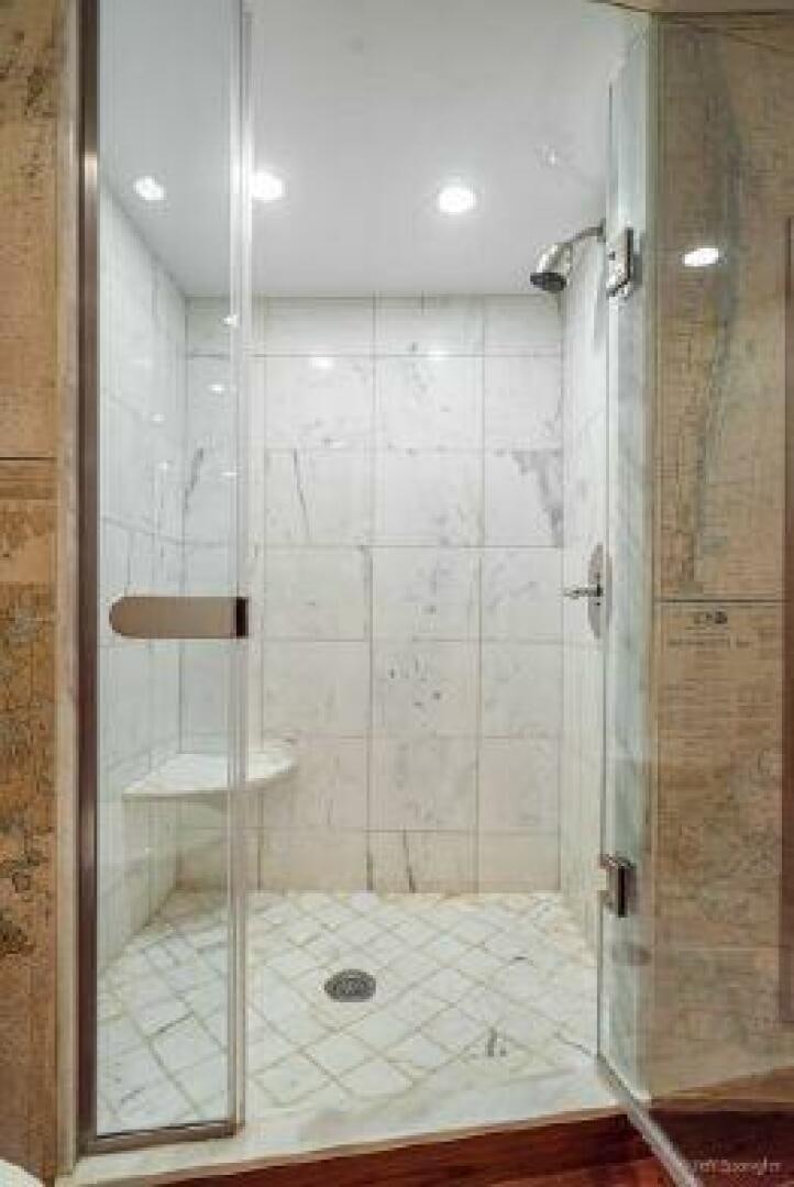 a shower with a glass door aboard DESPERADO Yacht for Sale