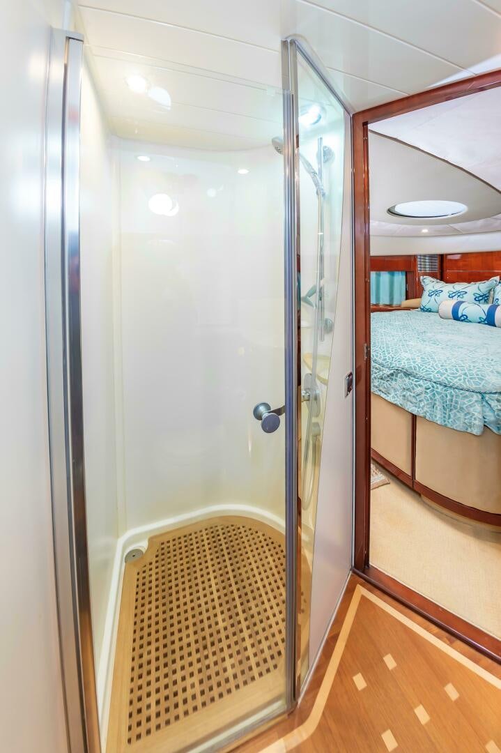 a bathroom with a glass shower aboard ANDREA'S REVENGE Yacht for Sale