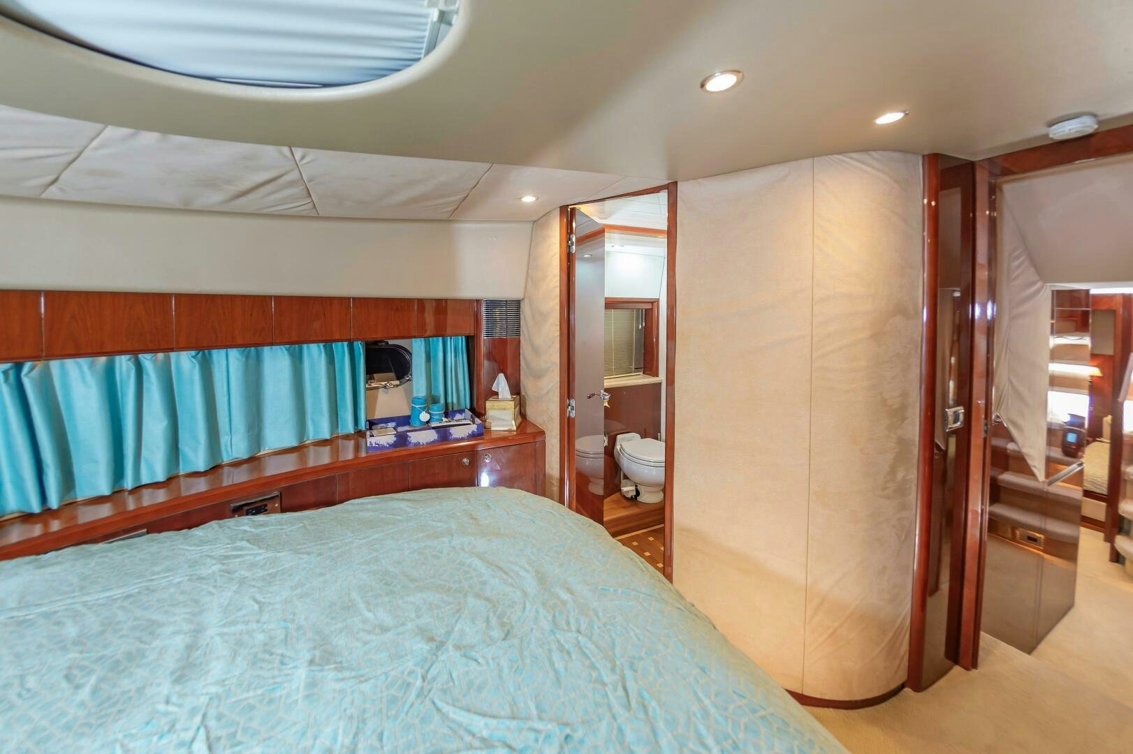 a bedroom with a bed and a closet aboard ANDREA'S REVENGE Yacht for Sale