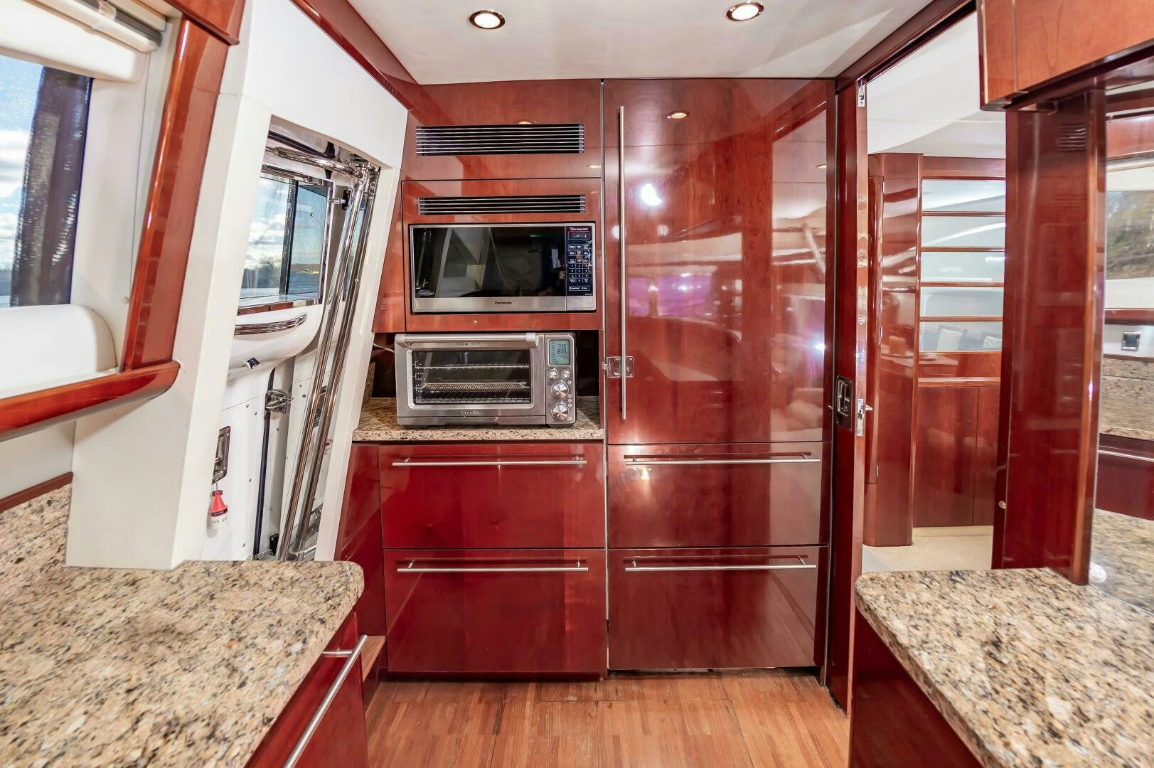 a kitchen with wooden cabinets aboard ANDREA'S REVENGE Yacht for Sale