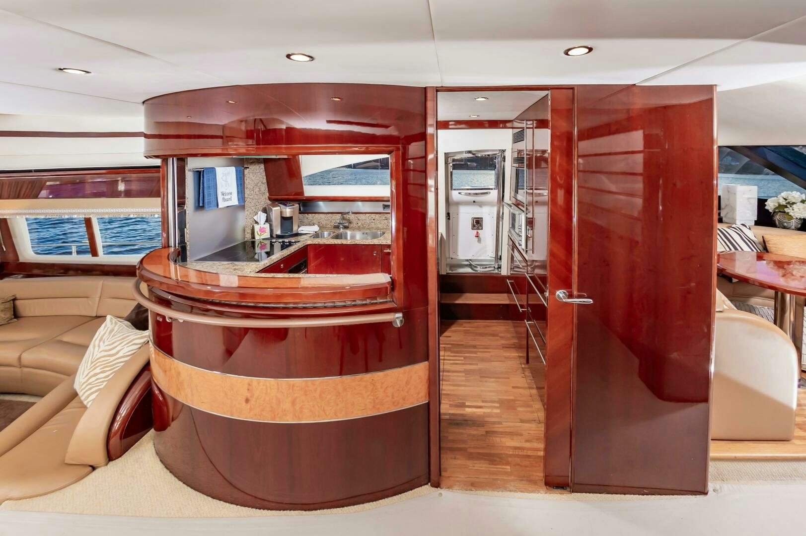 a room with a wood door and a wood cabinet with a mirror aboard ANDREA'S REVENGE Yacht for Sale