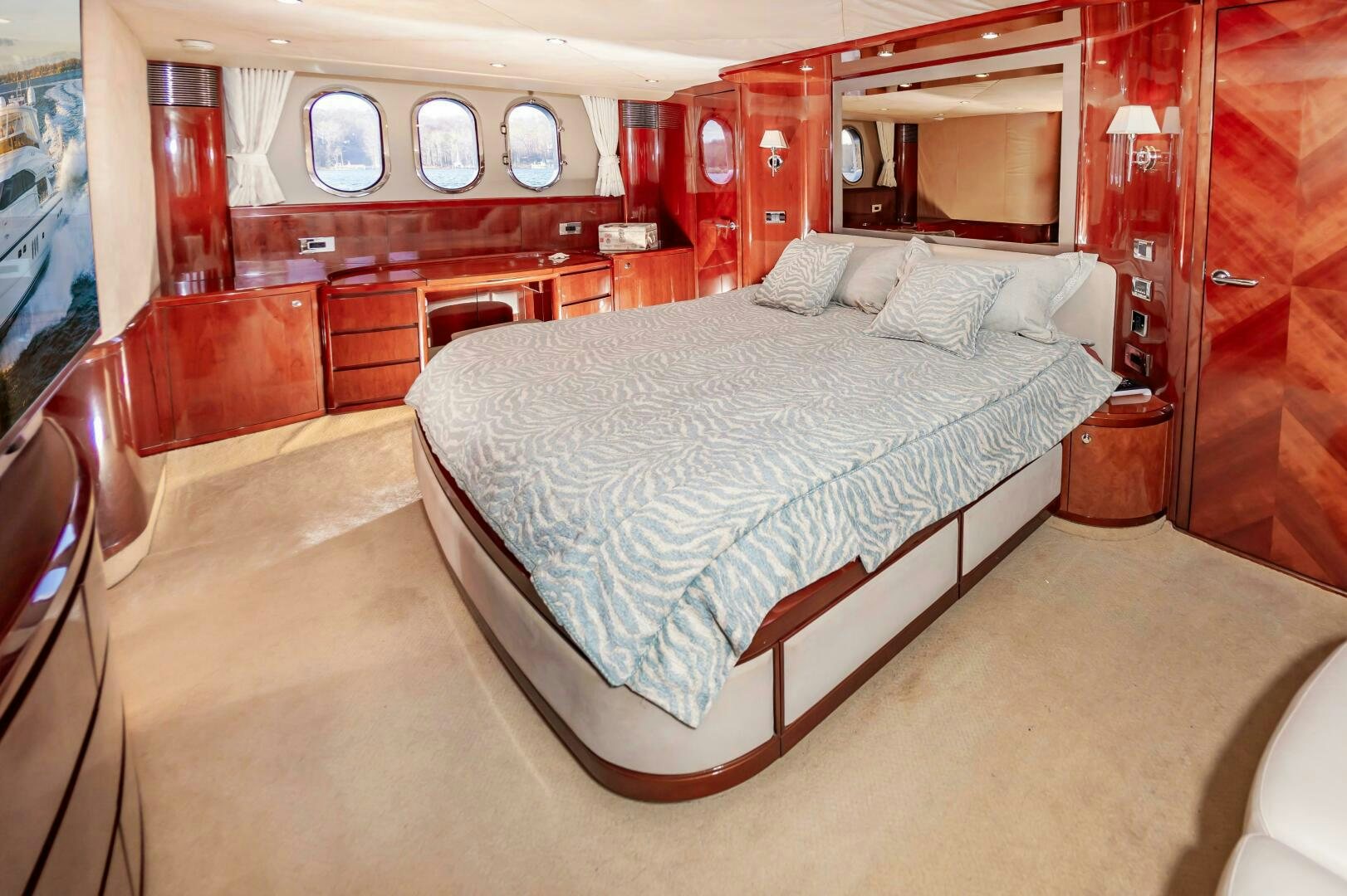 a bedroom with a bed and a desk aboard ANDREA'S REVENGE Yacht for Sale