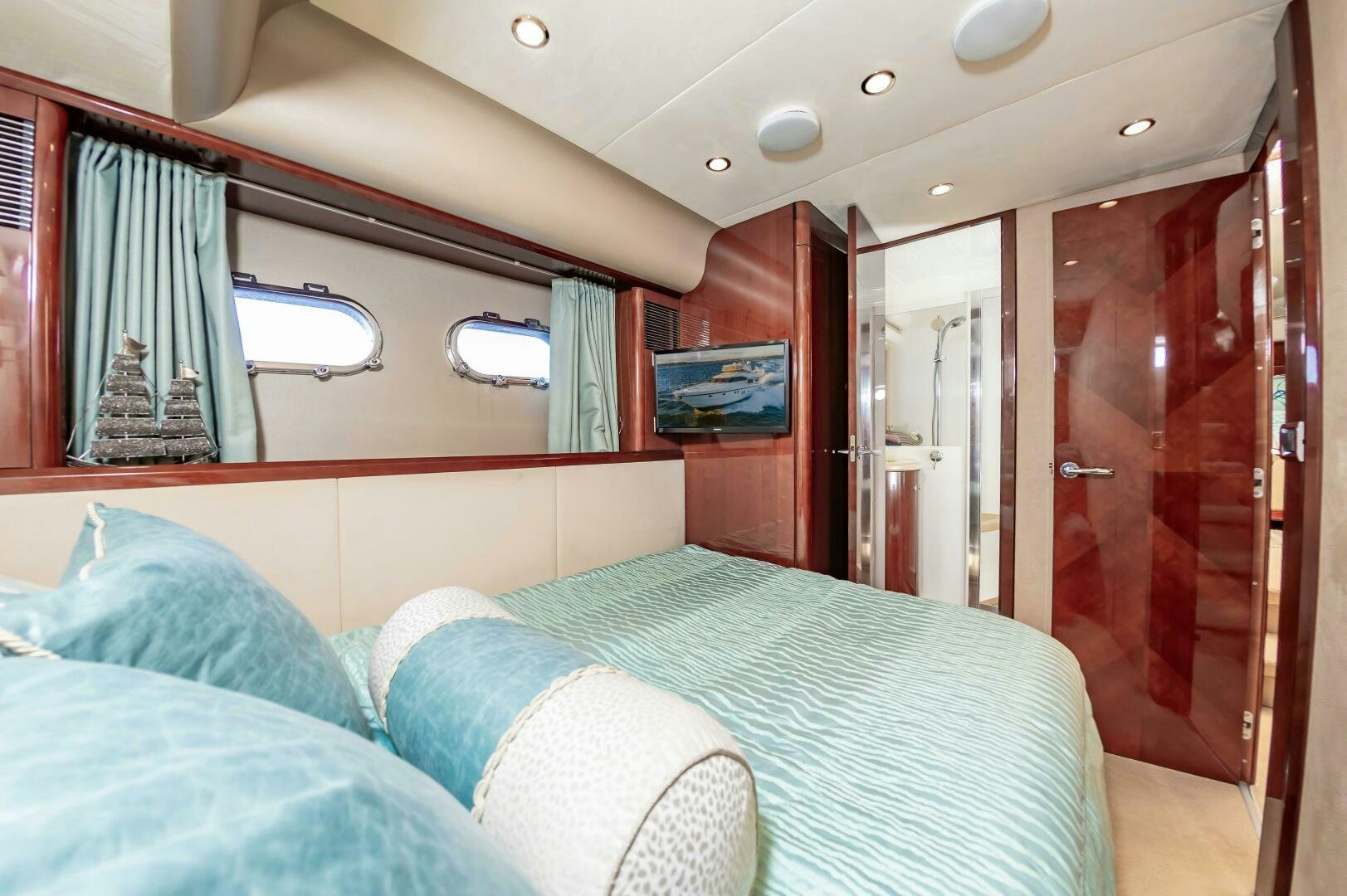 a room with a bed and a mirror aboard ANDREA'S REVENGE Yacht for Sale