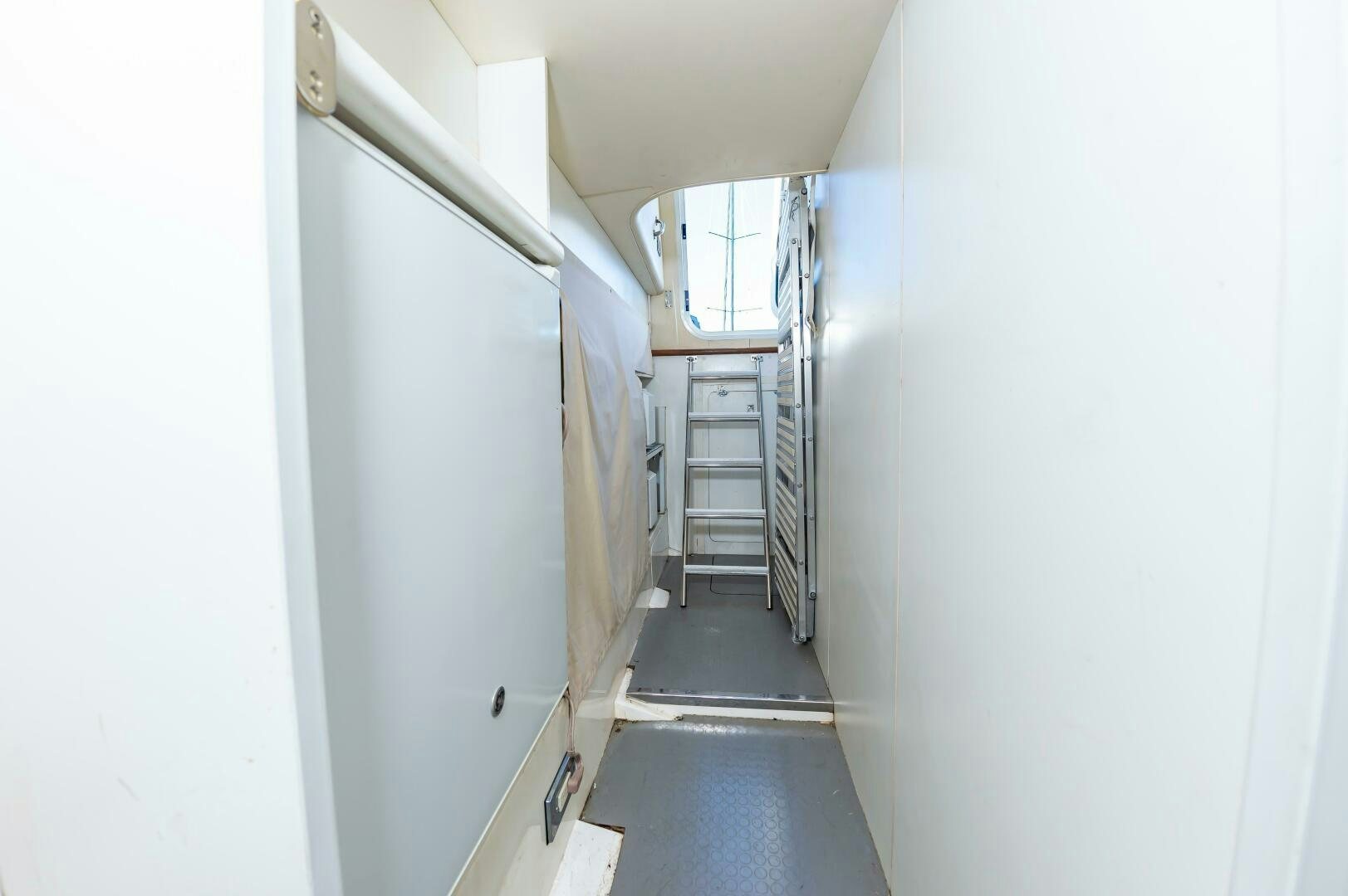a hallway with white walls aboard ANDREA'S REVENGE Yacht for Sale