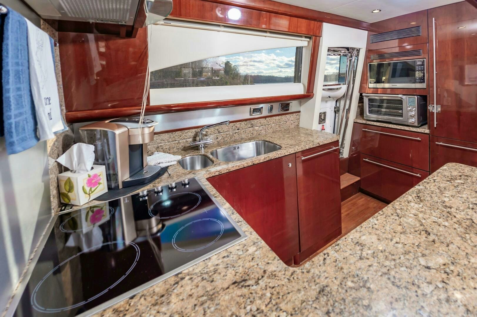 a kitchen with red cabinets aboard ANDREA'S REVENGE Yacht for Sale