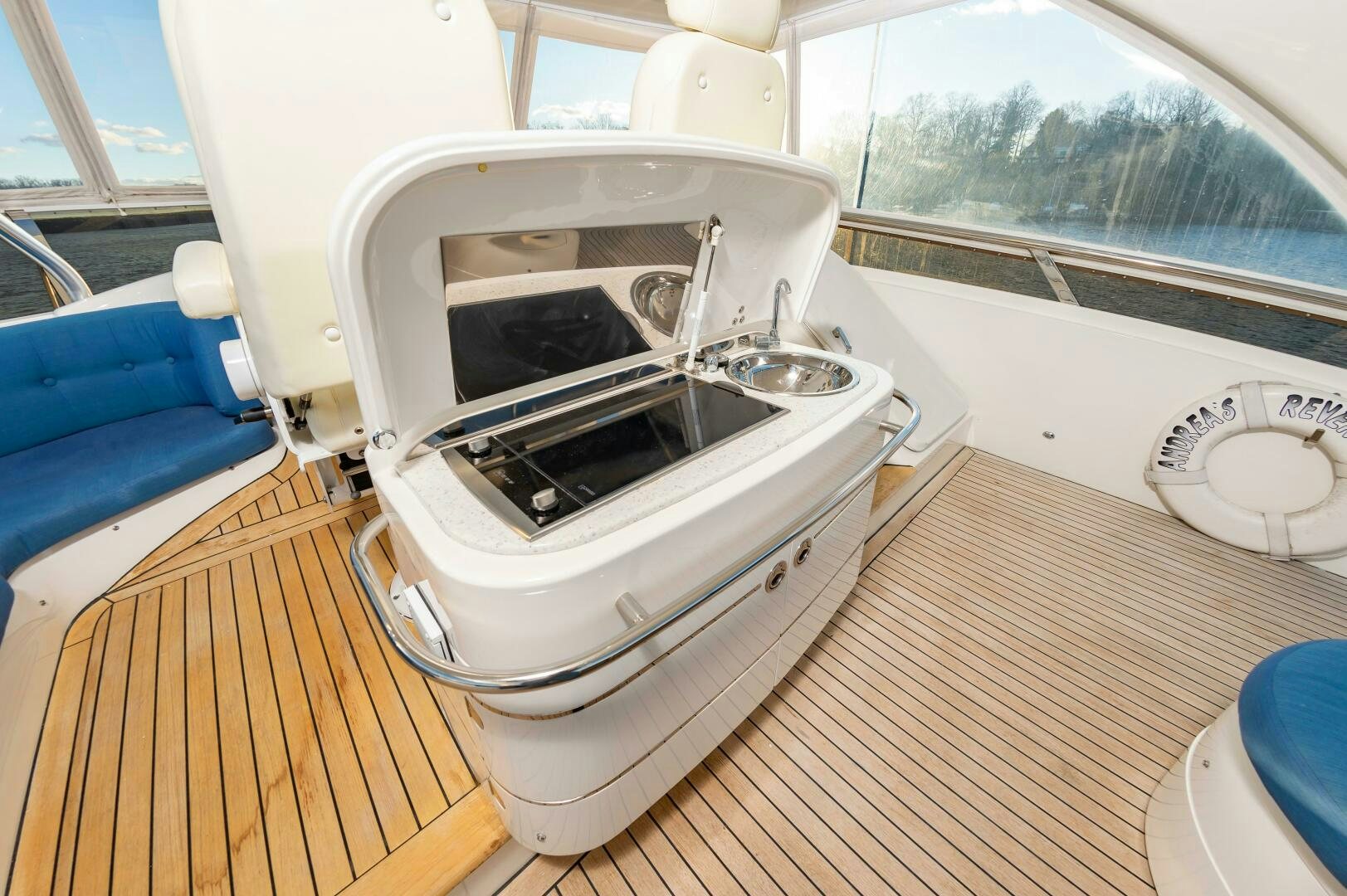 a white car with a hood aboard ANDREA'S REVENGE Yacht for Sale