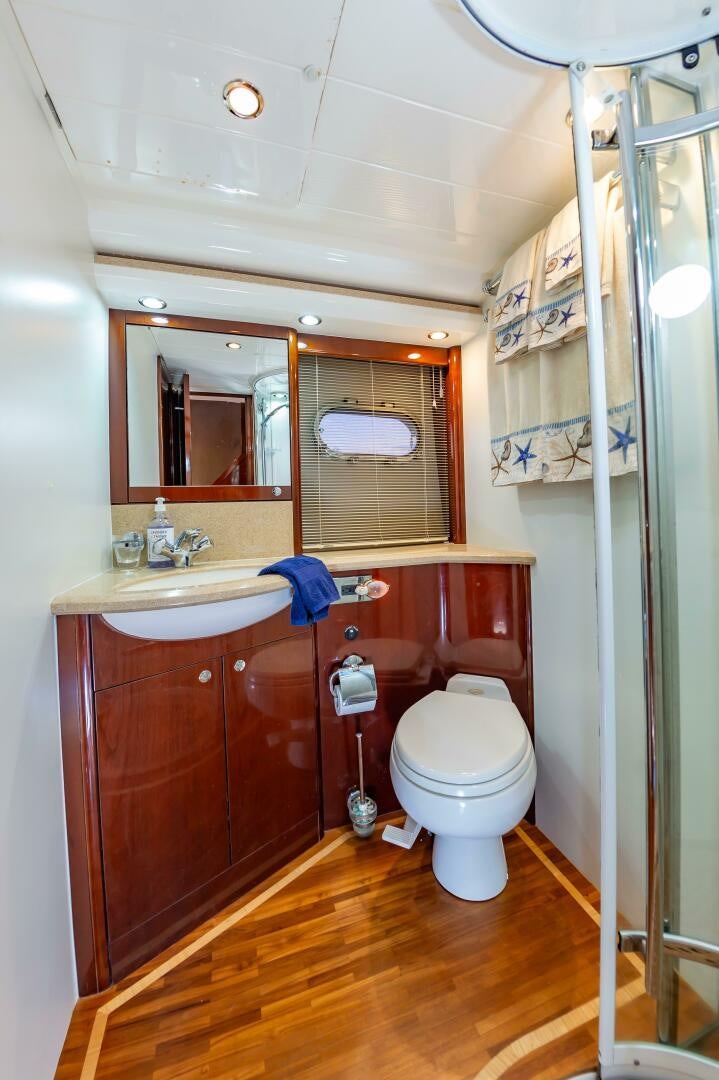 a bathroom with a toilet and a sink aboard ANDREA'S REVENGE Yacht for Sale