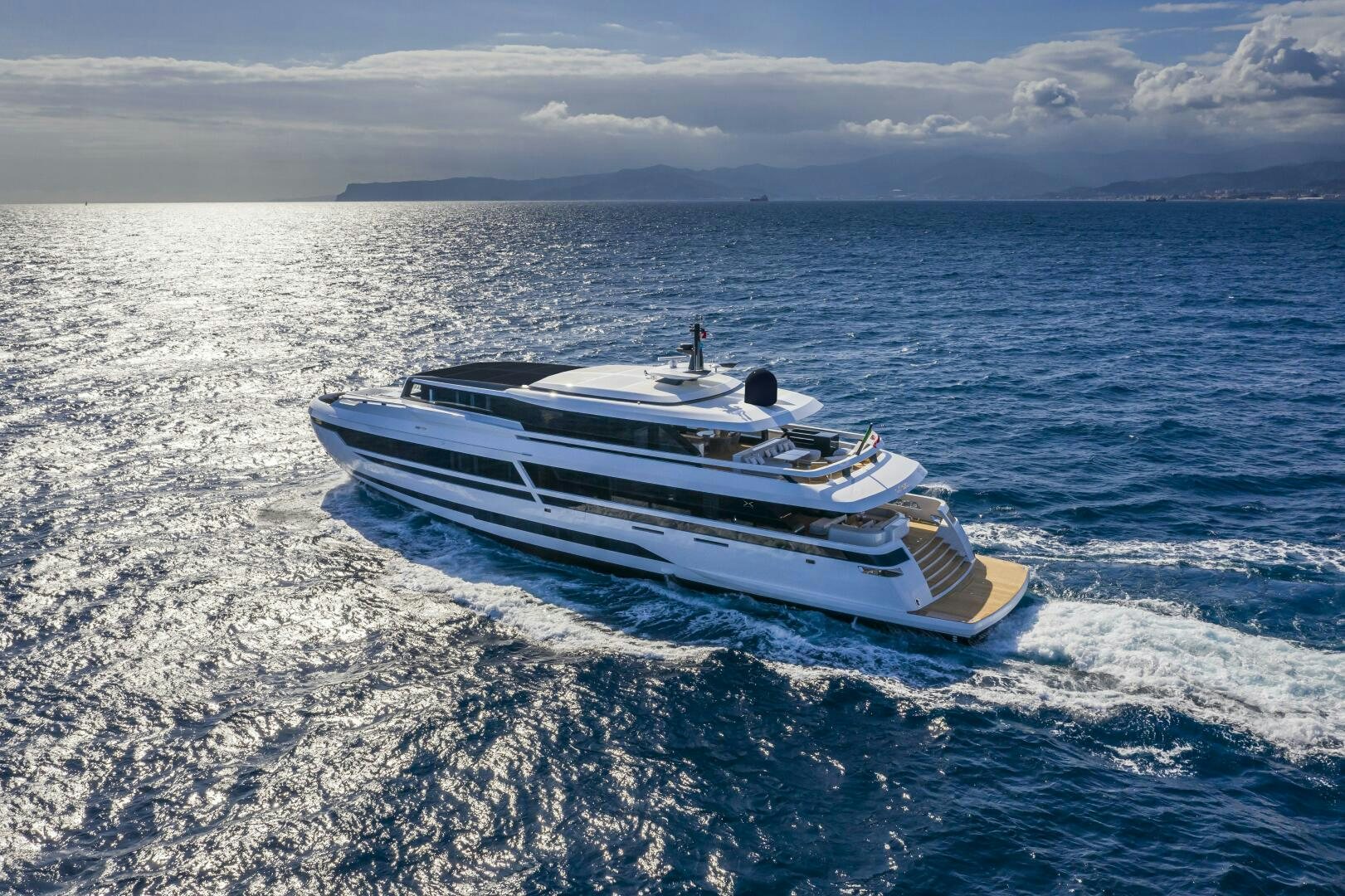 a boat in the water aboard X130 TRIPLEX Yacht for Sale