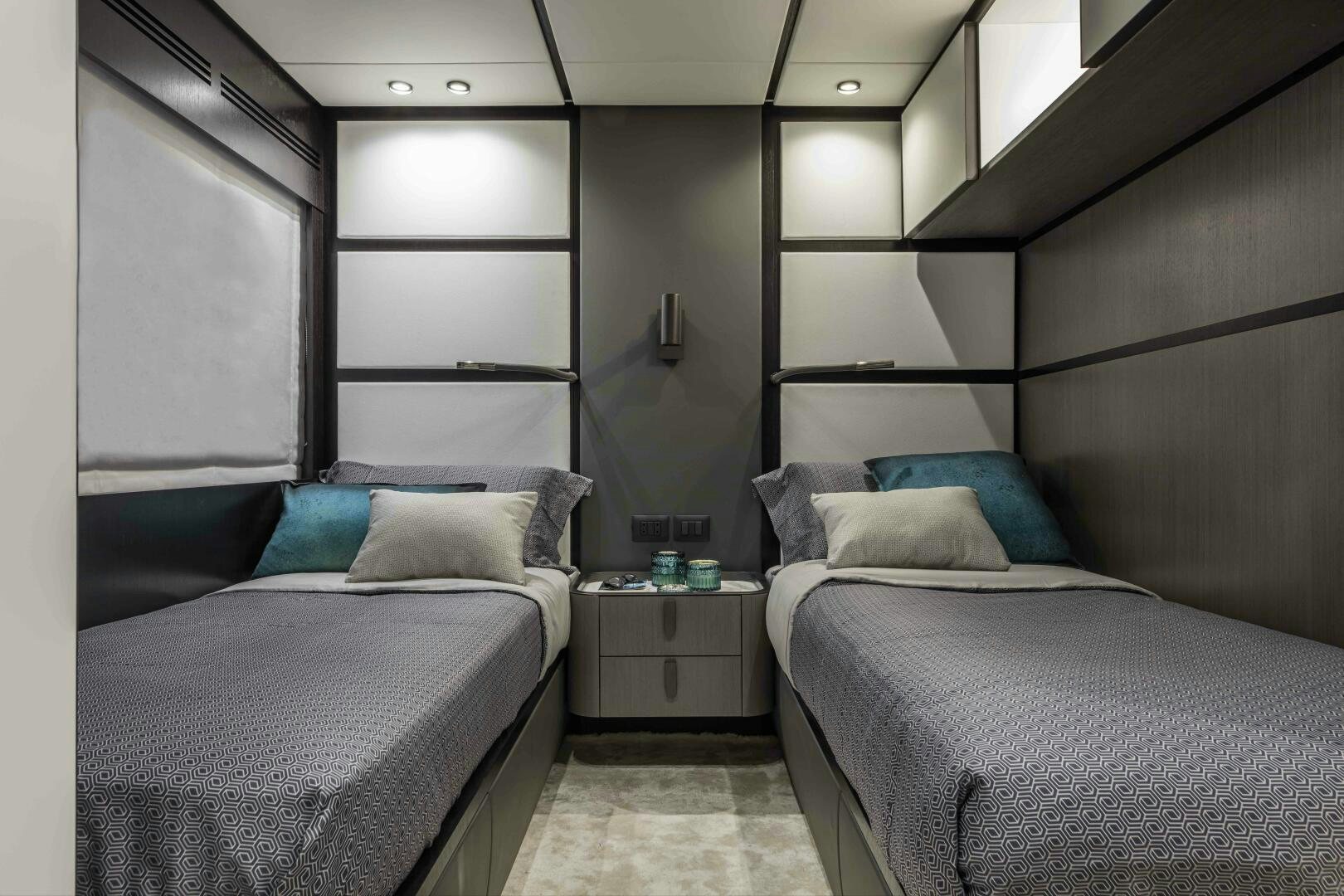 a room with two beds aboard X130 TRIPLEX Yacht for Sale