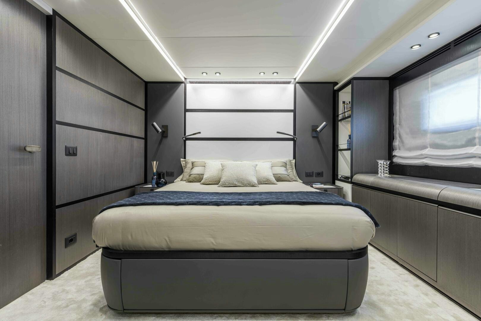 a bed in a room aboard X130 TRIPLEX Yacht for Sale