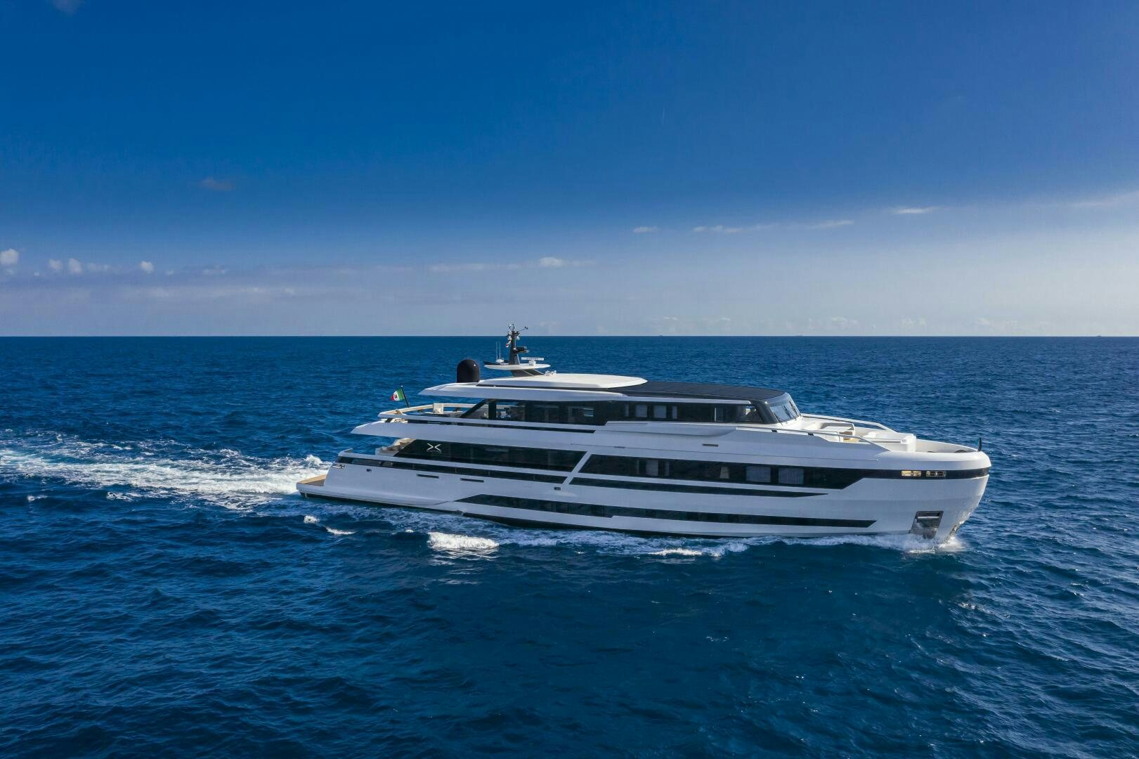 a boat in the water aboard X130 TRIPLEX Yacht for Sale