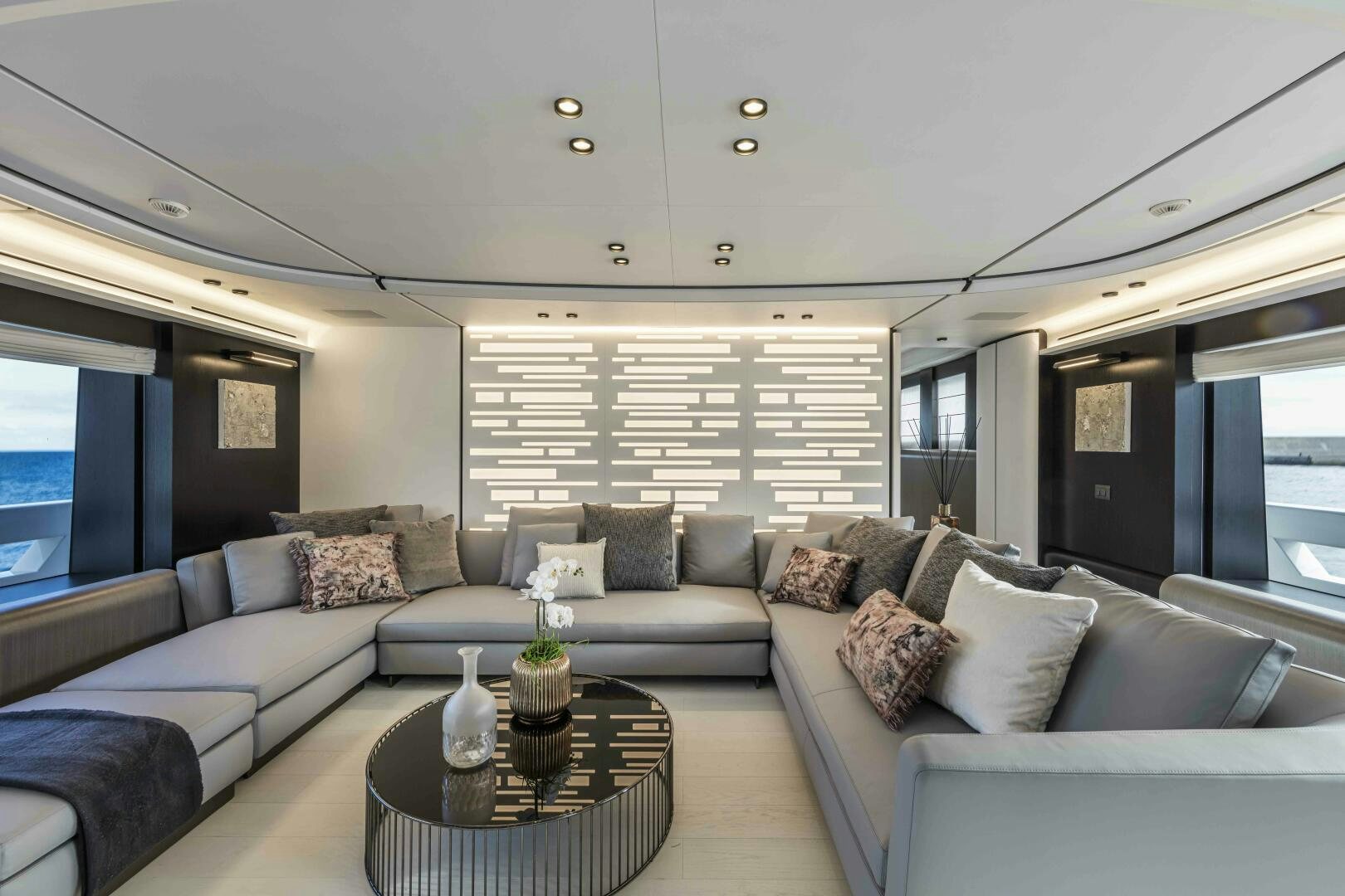 a living room with a couch and a coffee table aboard X130 TRIPLEX Yacht for Sale
