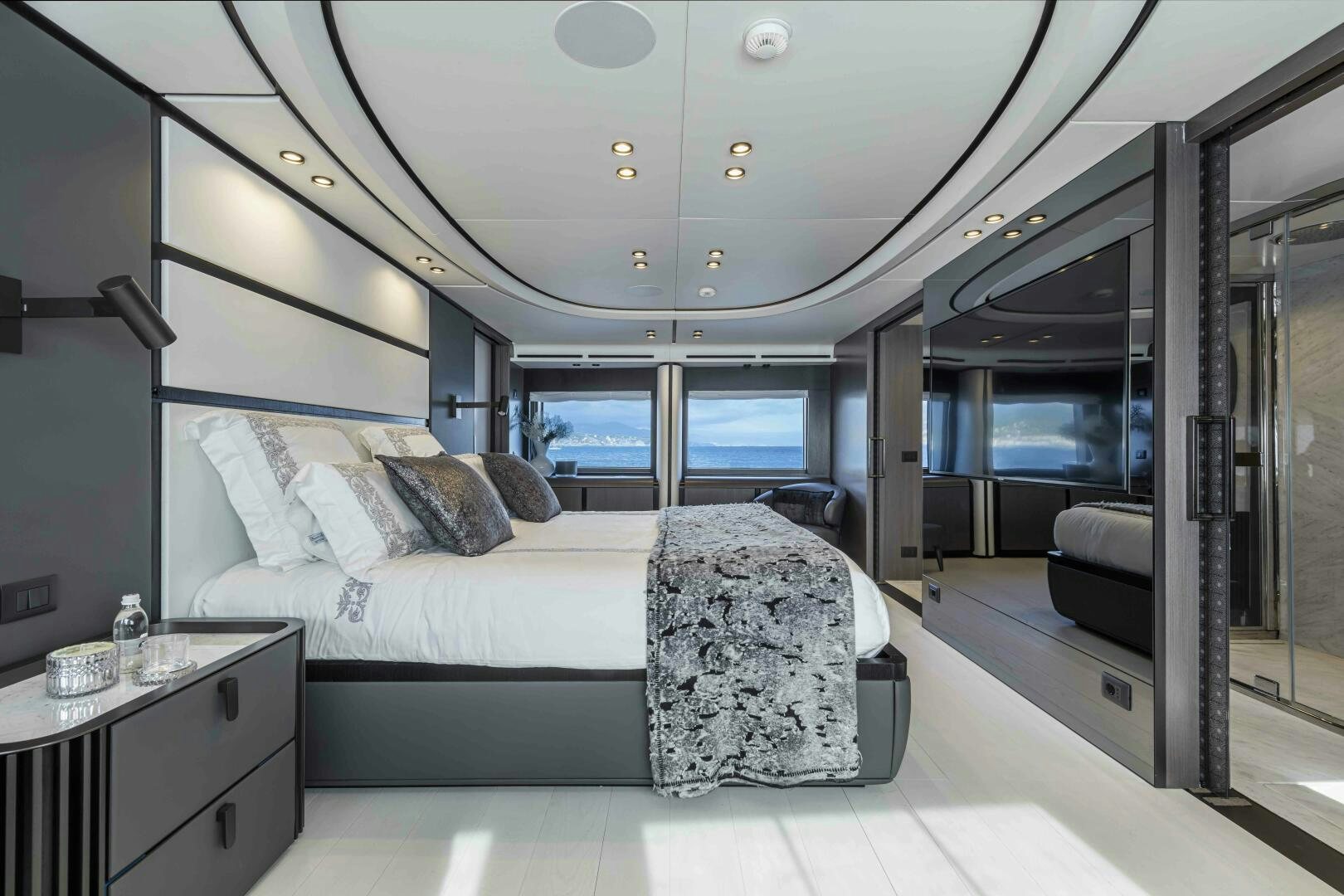 a bed in a room aboard X130 TRIPLEX Yacht for Sale
