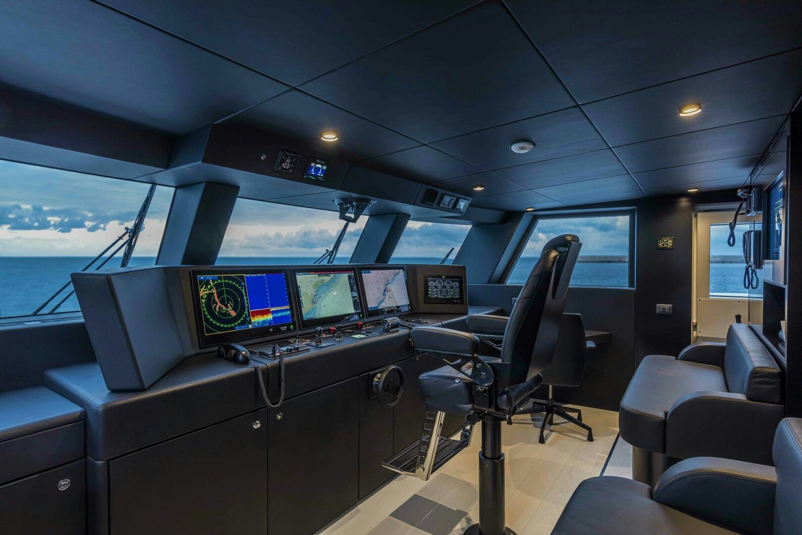 inside of a vehicle with many screens aboard X130 TRIPLEX Yacht for Sale