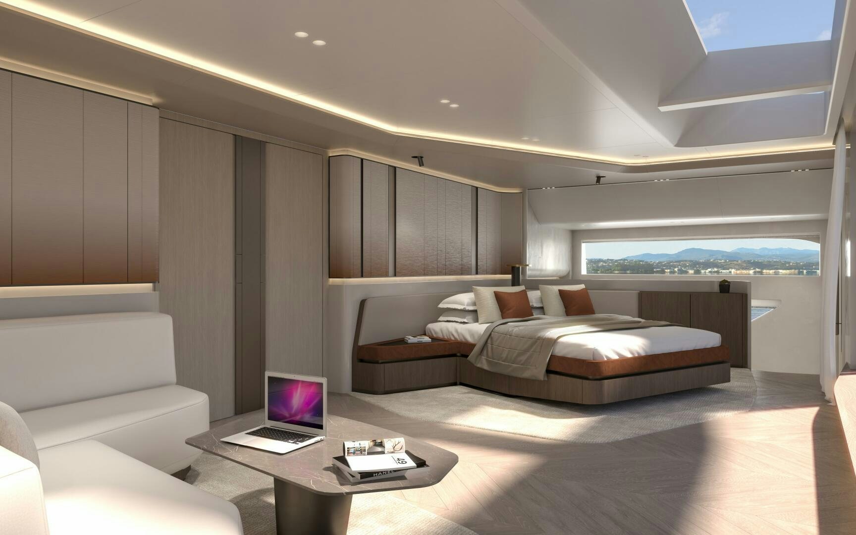 a room with a bed and a laptop on a table aboard X30 VILLA Yacht for Sale