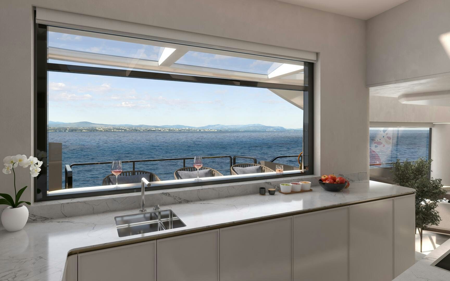 a kitchen with a large window overlooking the ocean aboard X30 VILLA Yacht for Sale