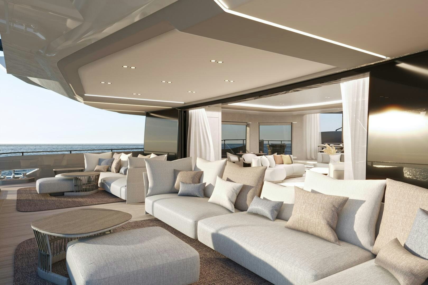 a living room with a large white sofa and a large window aboard X30 VILLA Yacht for Sale