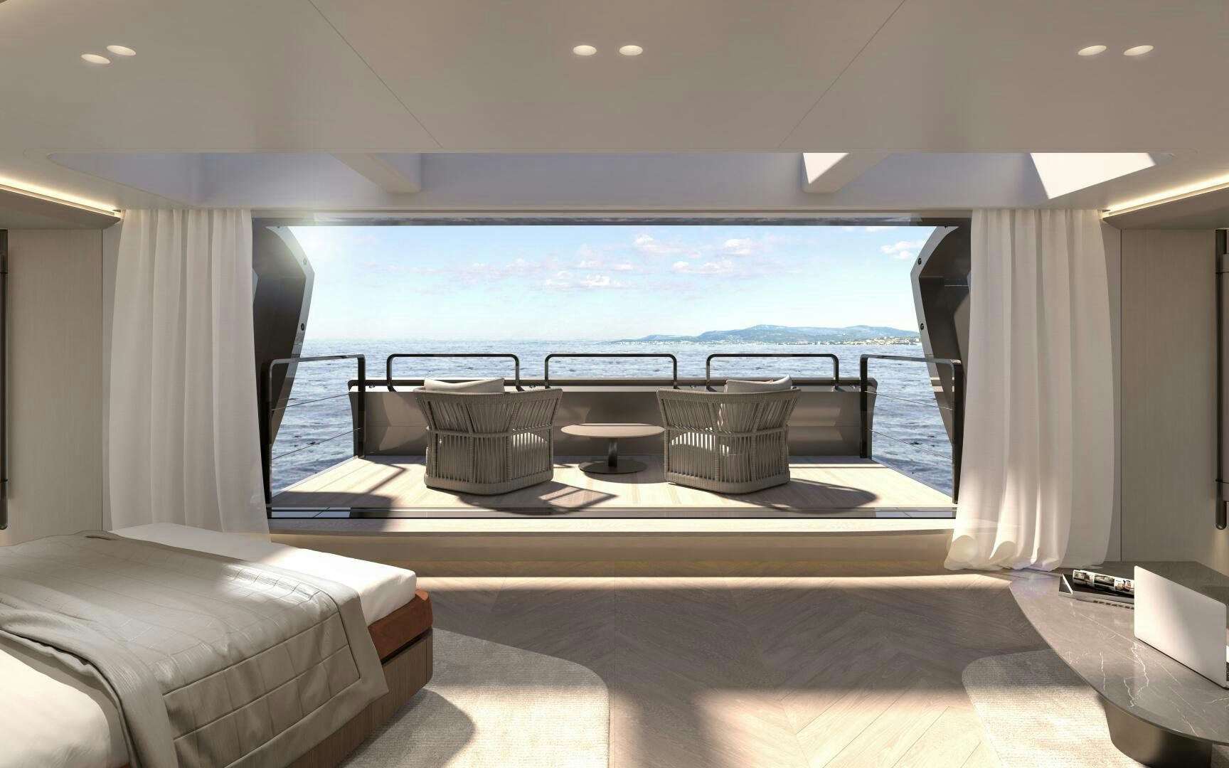 a room with a bed and a table and a chair aboard X30 VILLA Yacht for Sale