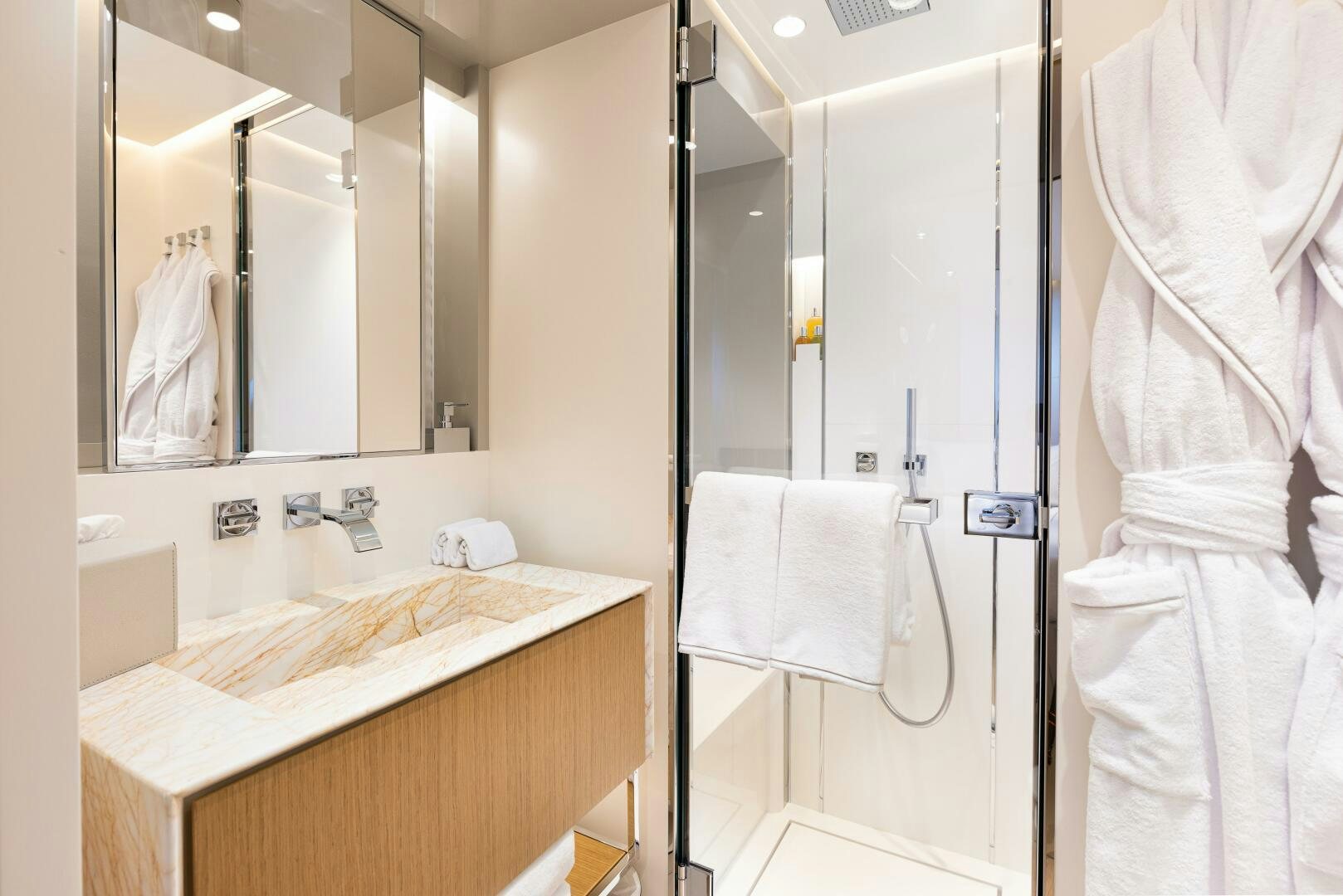 a bathroom with a large mirror aboard X99 FAST Yacht for Sale