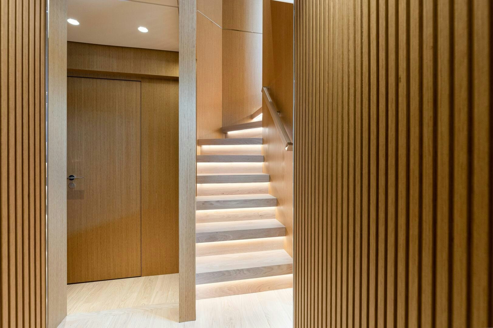 a hallway with a wood door aboard X99 FAST Yacht for Sale