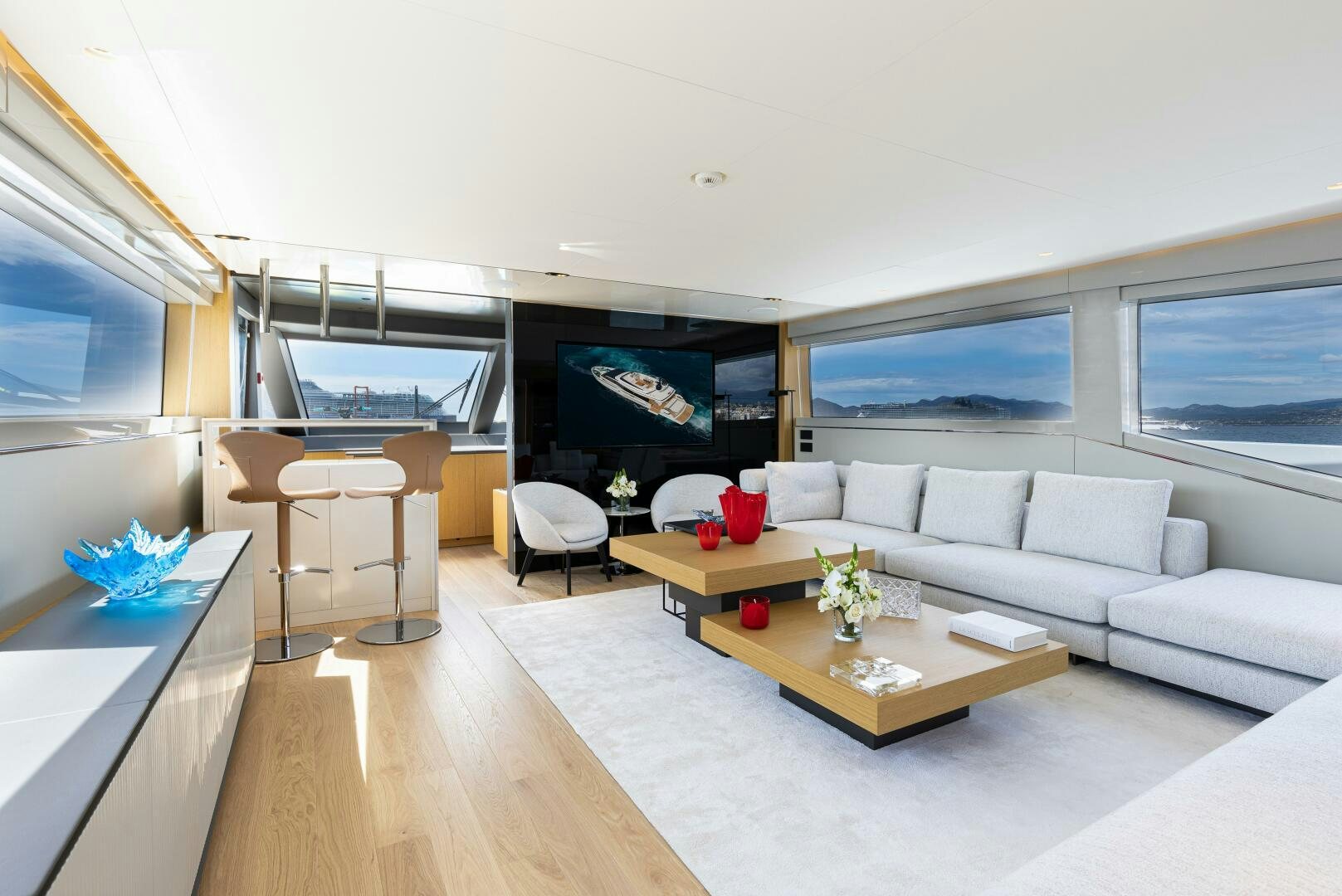 a living room with a large screen aboard X99 FAST Yacht for Sale