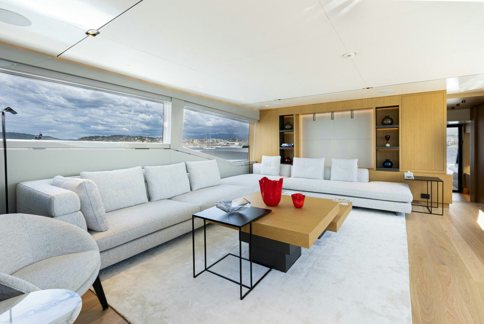 a living room with a couch and a table aboard X99 FAST Yacht for Sale