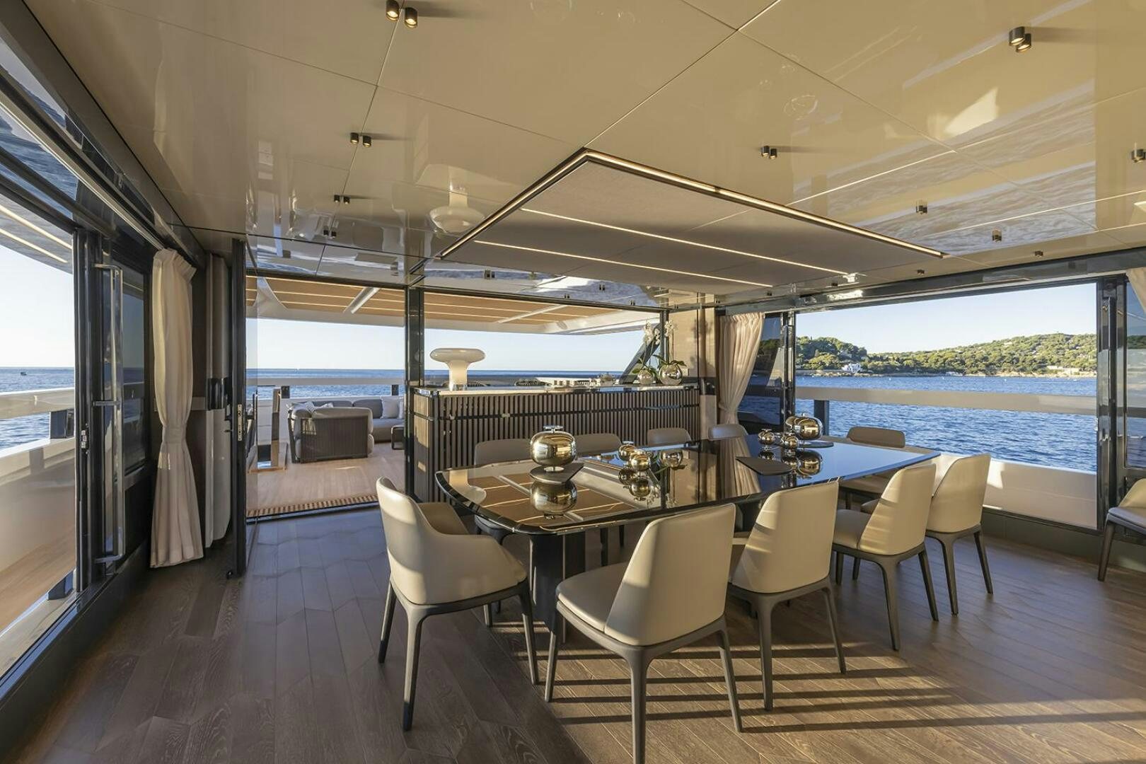 a room with a table and chairs aboard X96 TRIPLEX Yacht for Sale