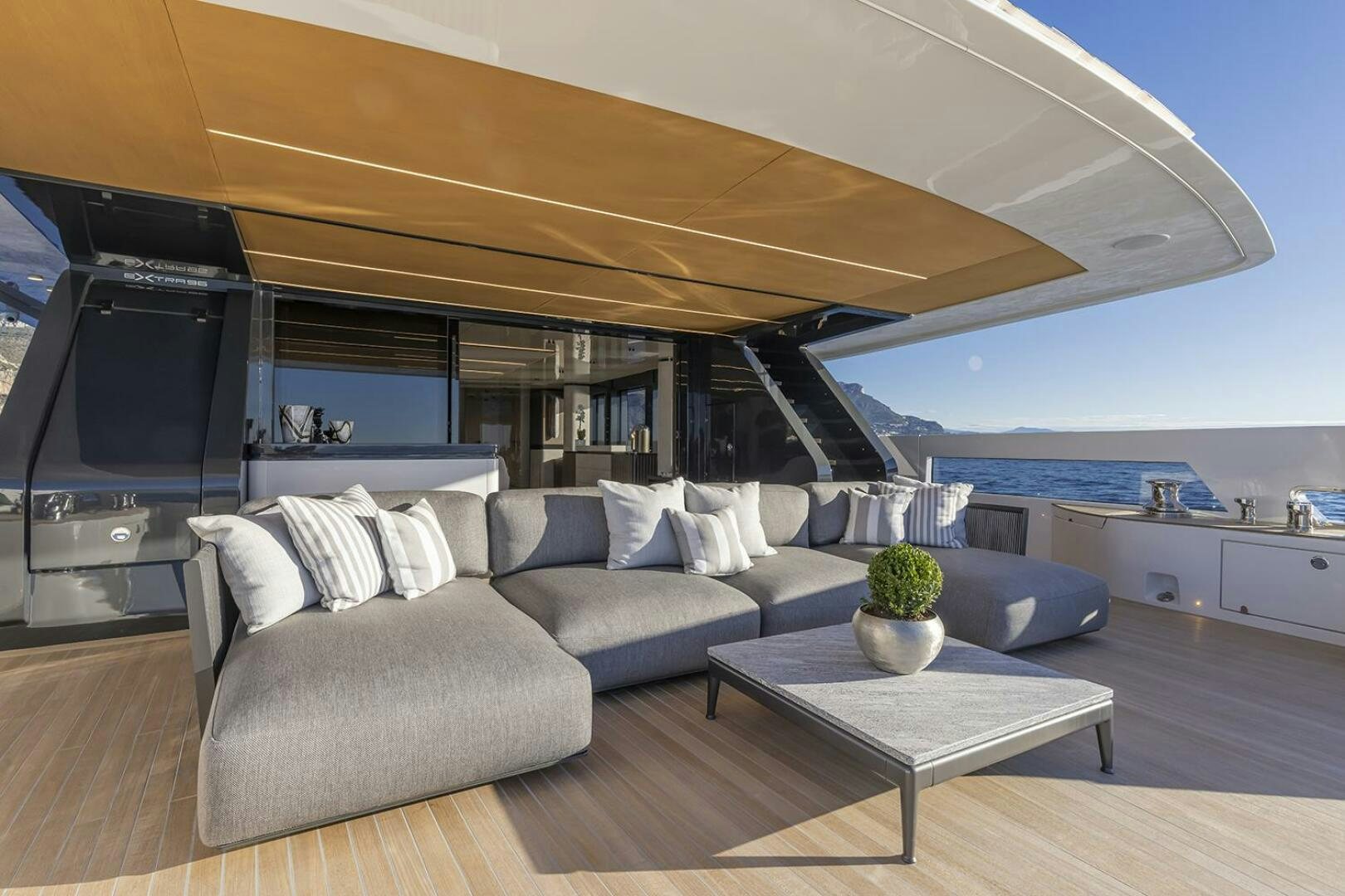 a living room with a large sofa aboard X96 TRIPLEX Yacht for Sale
