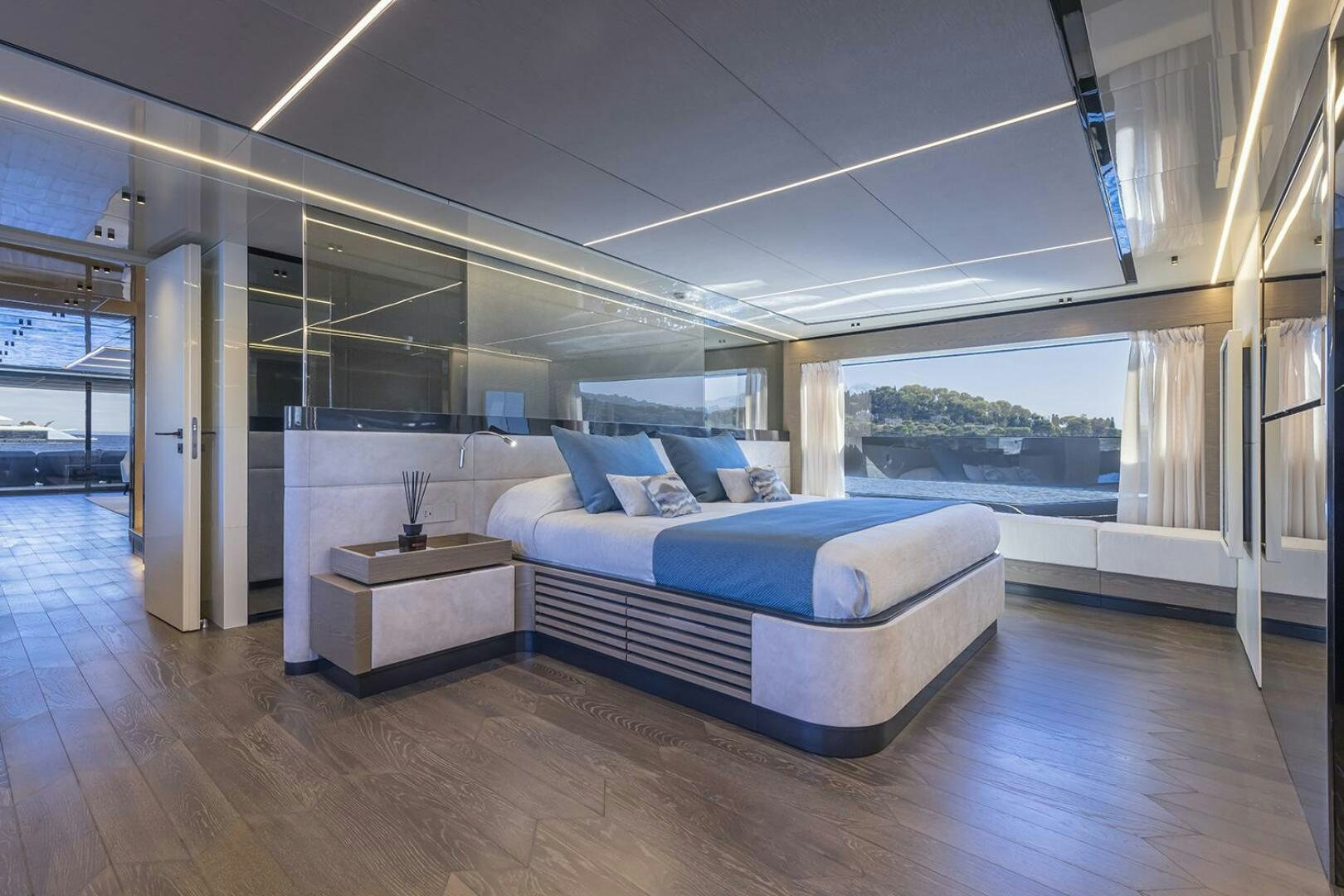 a room with a bed and a table aboard X96 TRIPLEX Yacht for Sale