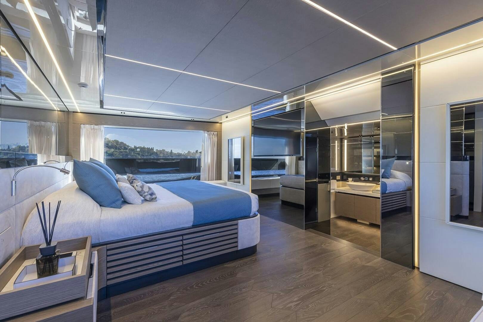 a bedroom with a bed and a desk aboard X96 TRIPLEX Yacht for Sale