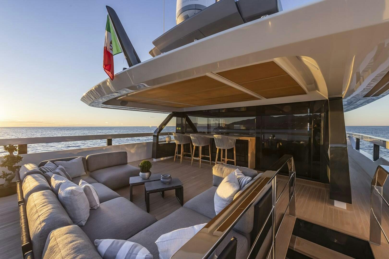 a large living room with a large deck and a large body of water aboard X96 TRIPLEX Yacht for Sale