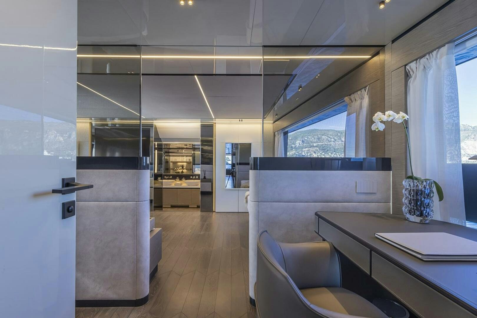 a kitchen with a table and chairs aboard X96 TRIPLEX Yacht for Sale