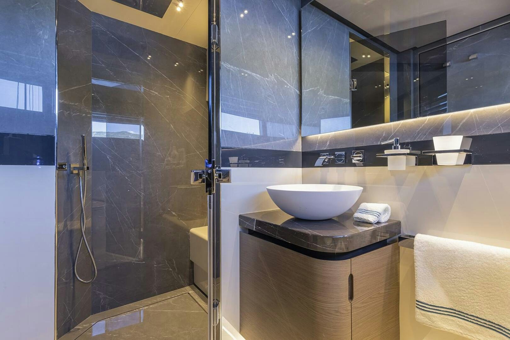 a bathroom with a sink and shower aboard X96 TRIPLEX Yacht for Sale