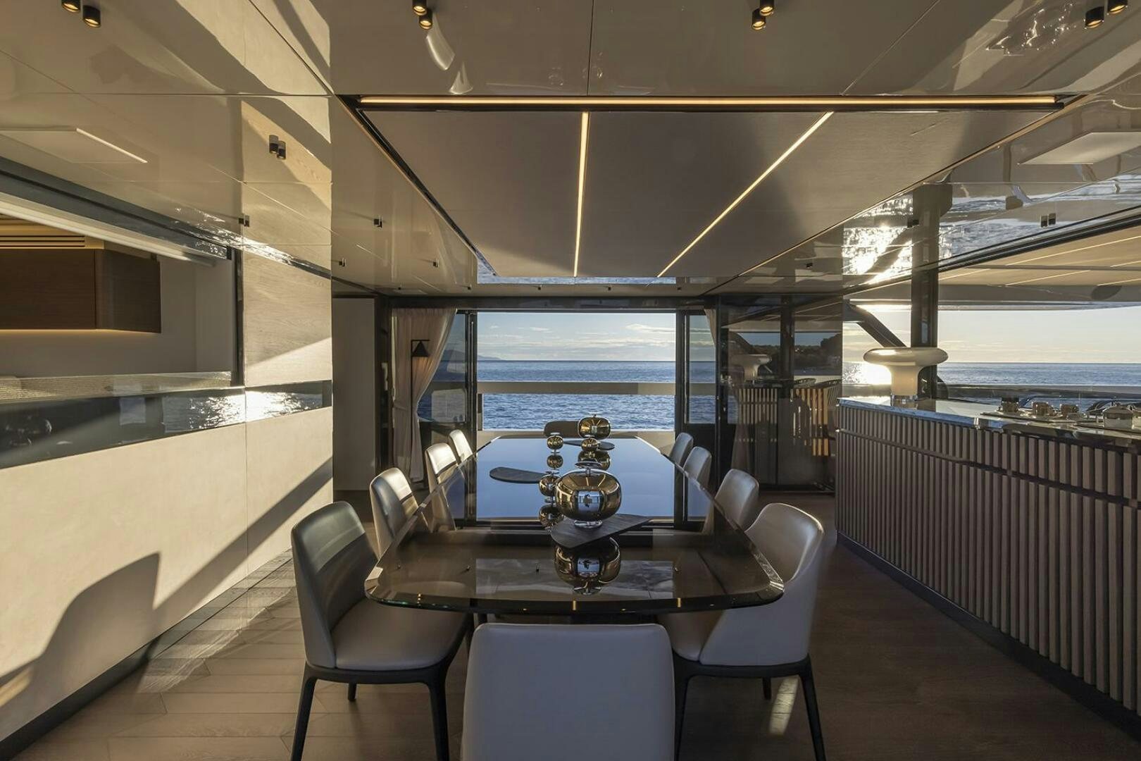 a room with a table and chairs aboard X96 TRIPLEX Yacht for Sale