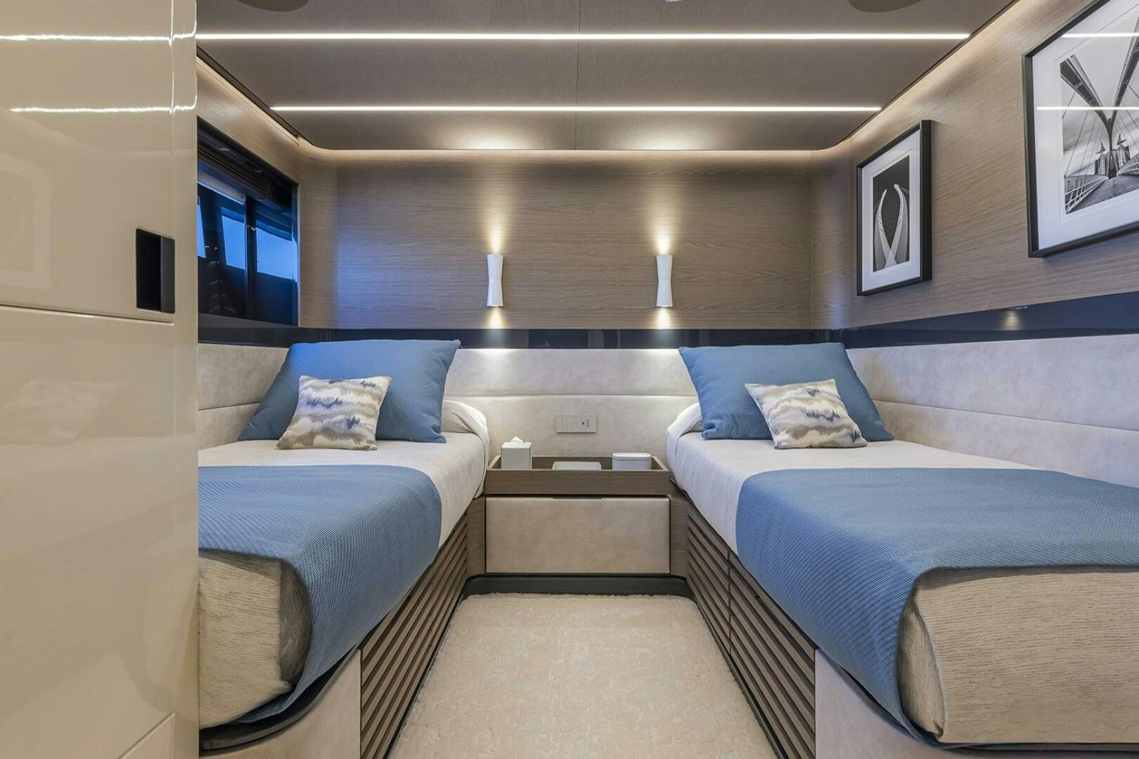 a room with beds and a window aboard X96 TRIPLEX Yacht for Sale