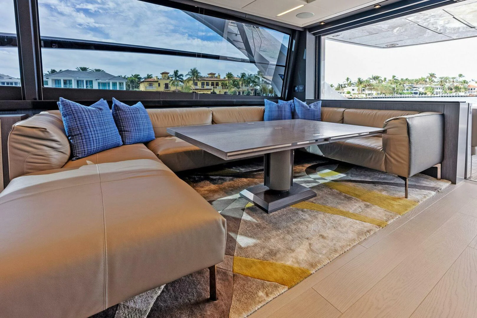 a couch and a table in a room aboard OUR TRADE Yacht for Sale