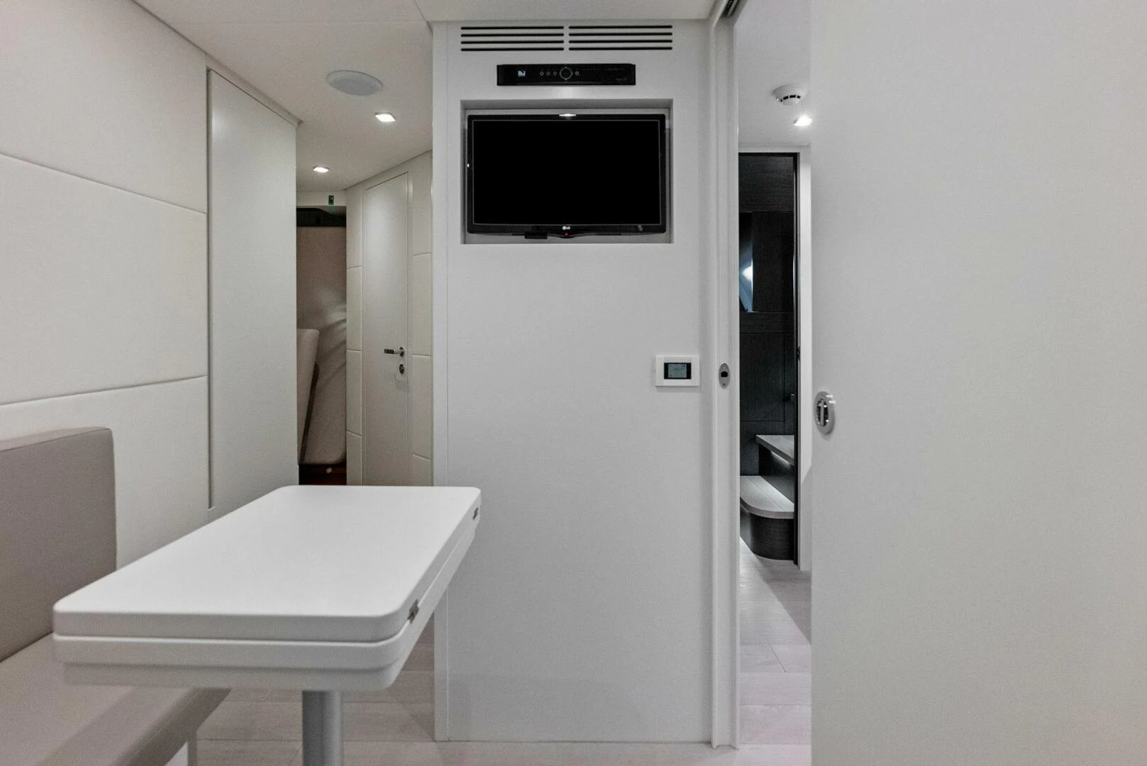 a bathroom with a tv and a toilet aboard OUR TRADE Yacht for Sale