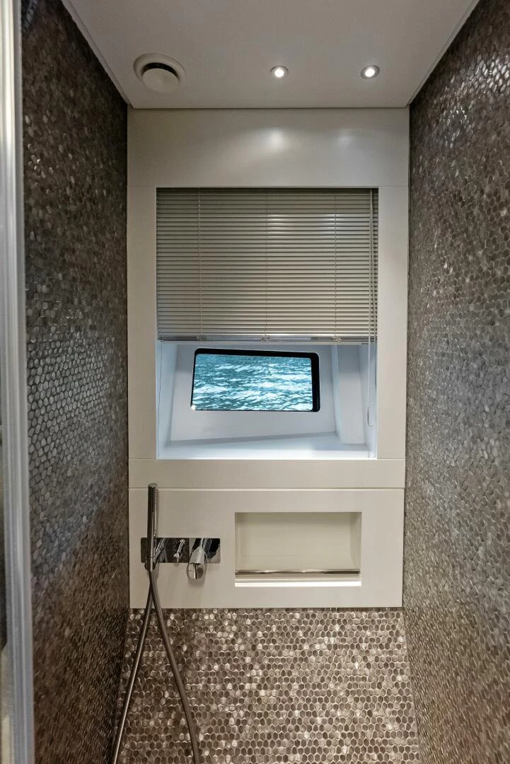 a window with a light on the side aboard OUR TRADE Yacht for Sale