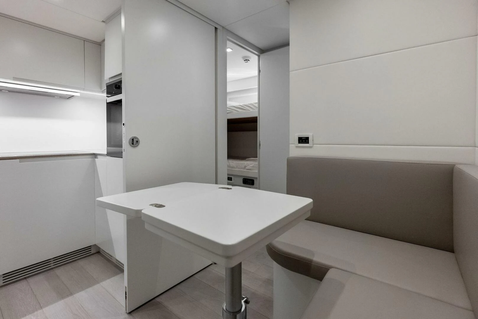 a room with a table and chairs aboard OUR TRADE Yacht for Sale
