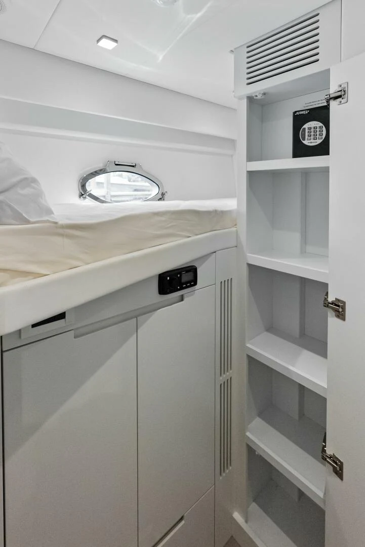 a white cabinet with a vent aboard OUR TRADE Yacht for Sale